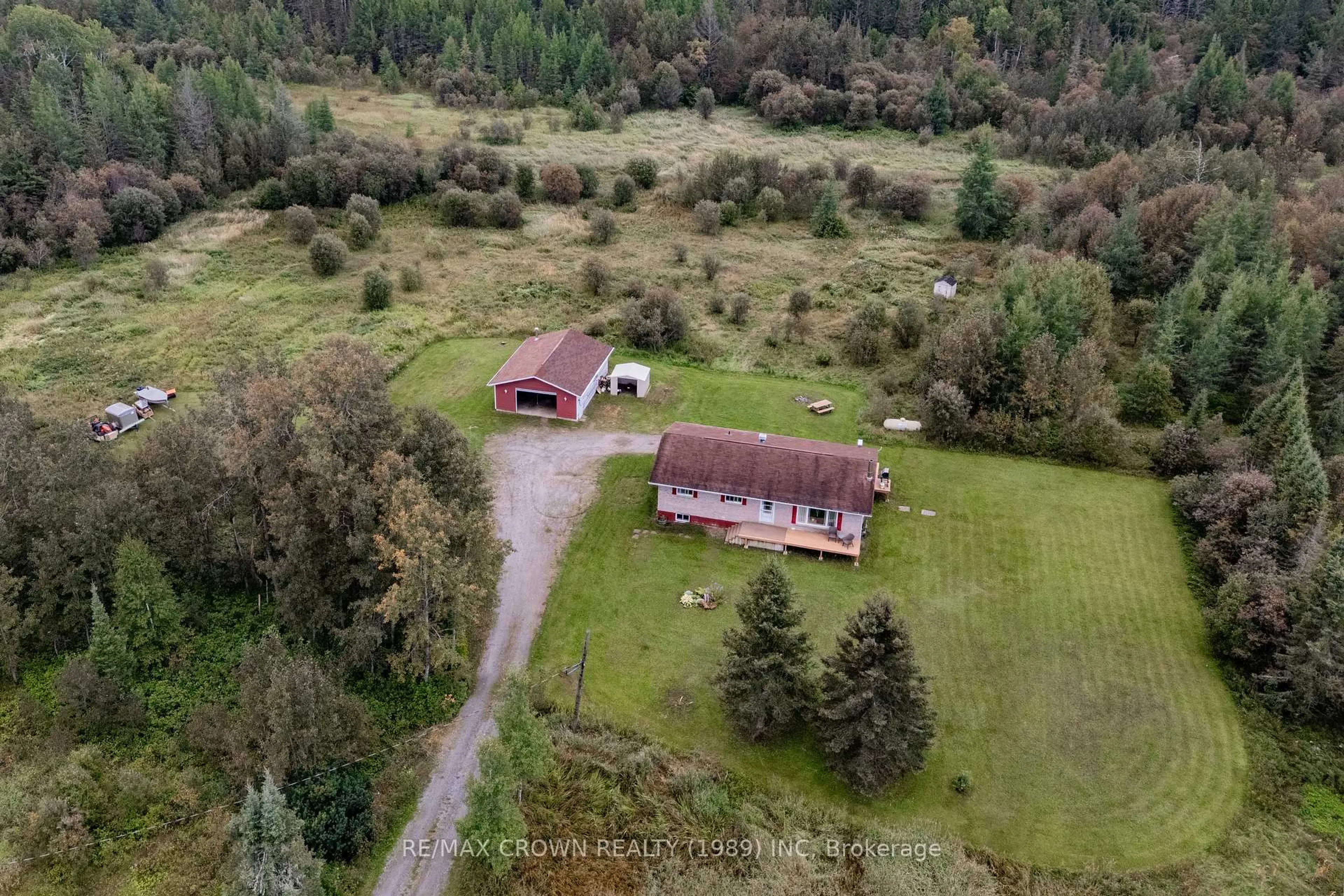 A pic from outside/outdoor area/front of a property/back of a property/a pic from drone, unknown for 12 St Joseph Rd, Kapuskasing Ontario P0L 1V0