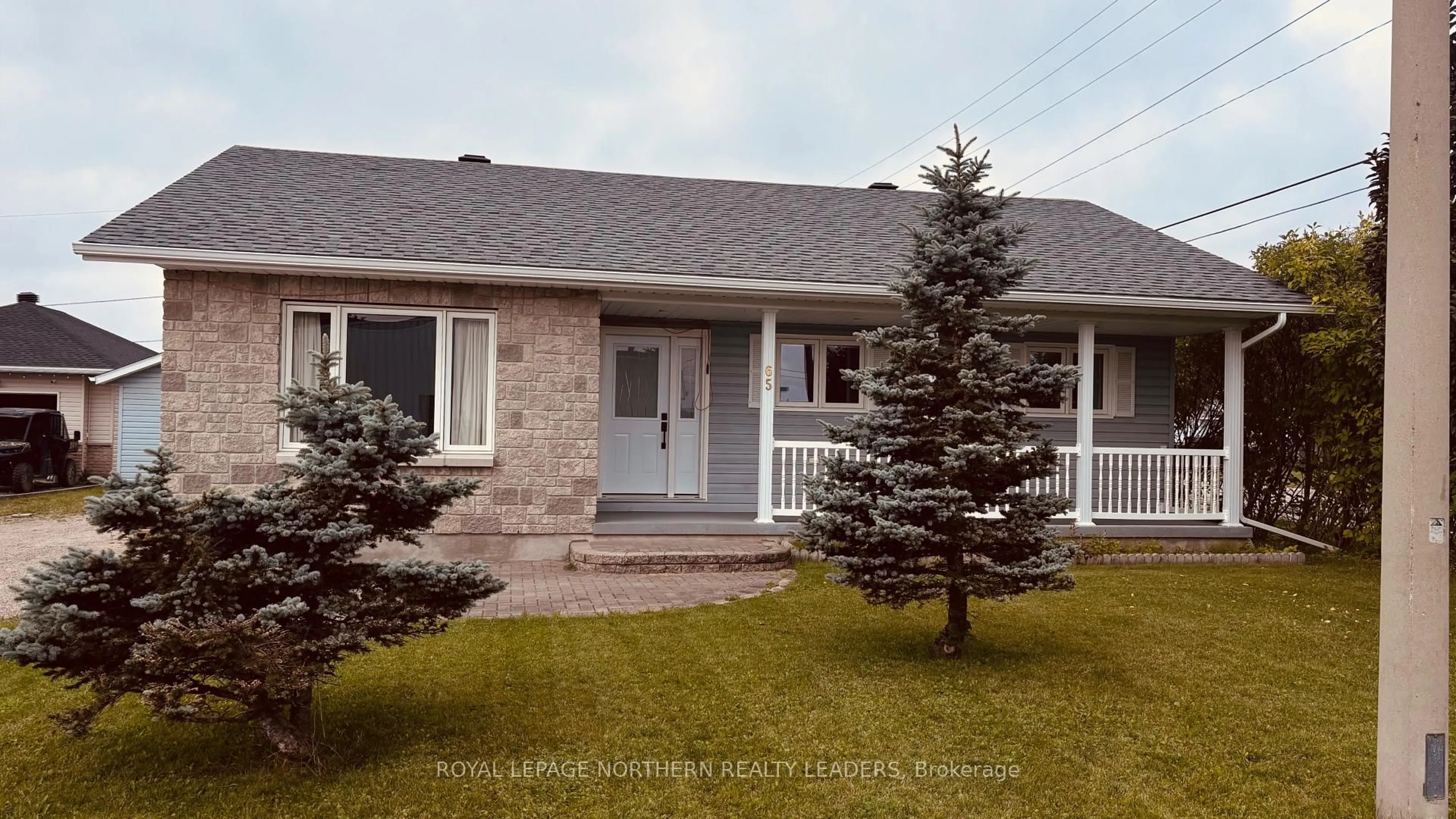 Home with vinyl exterior material, street for 65 Connaught Ave, Cochrane Ontario P0L 1C0