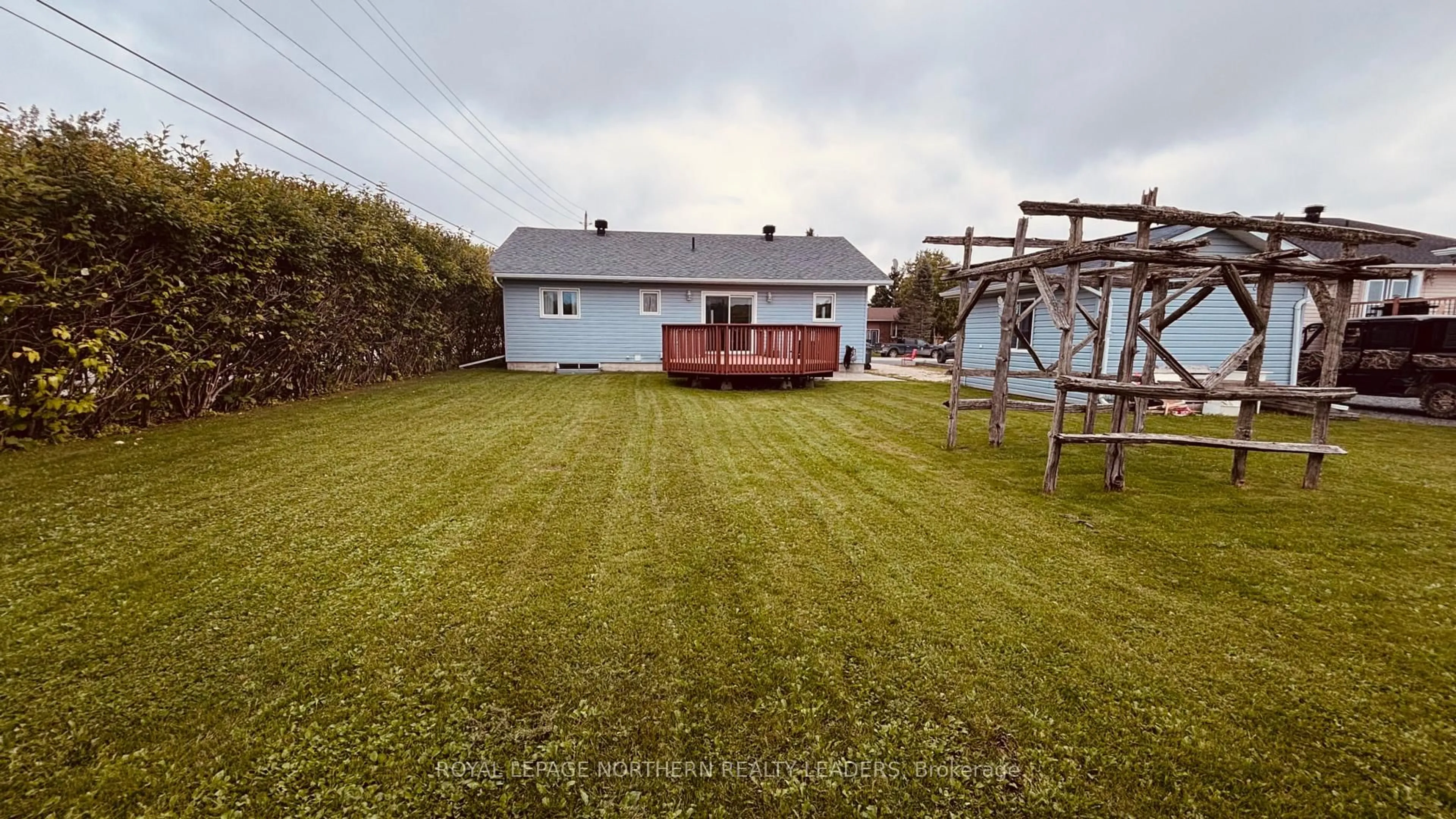 A pic from outside/outdoor area/front of a property/back of a property/a pic from drone, unknown for 65 Connaught Ave, Cochrane Ontario P0L 1C0