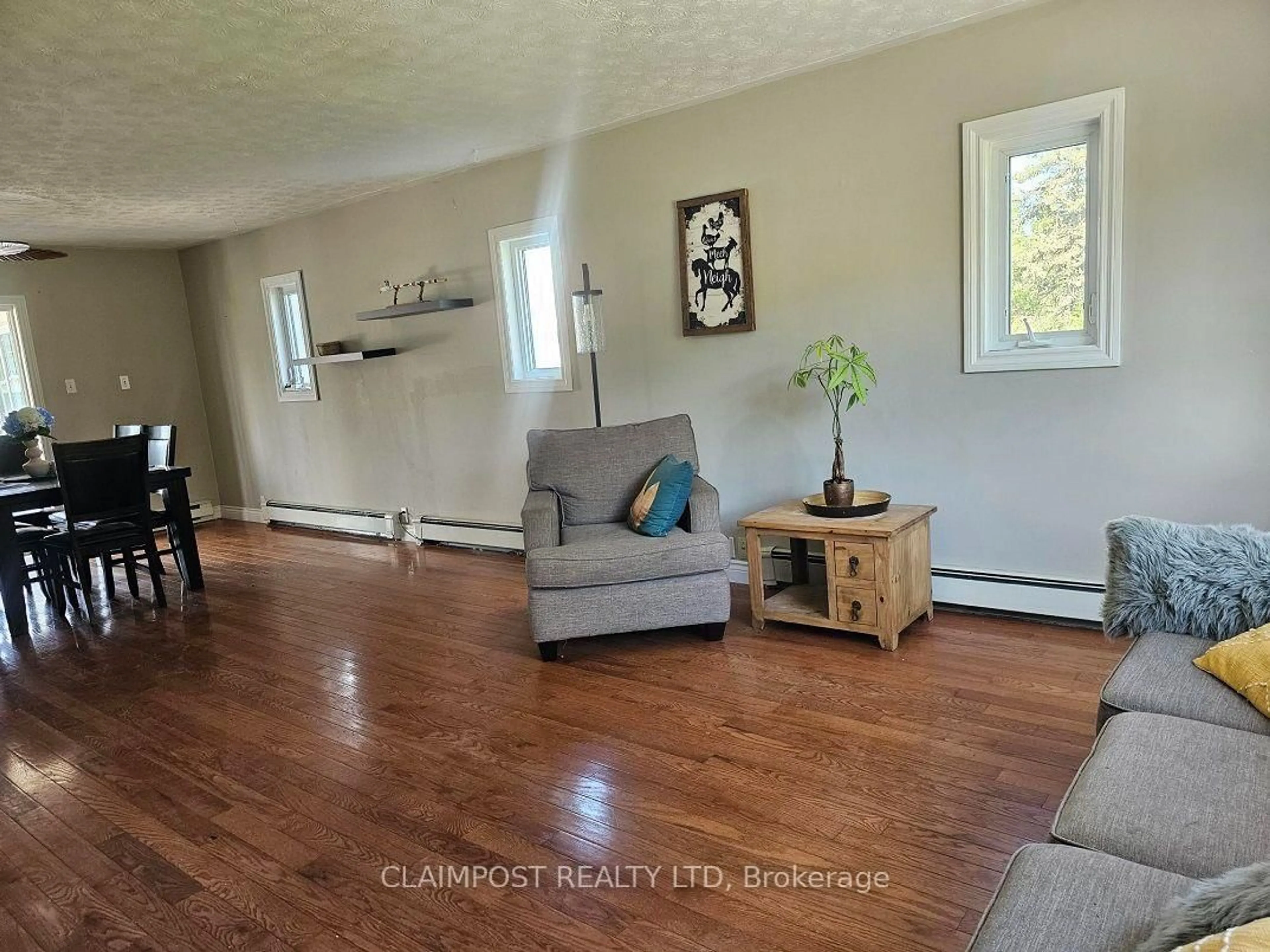 Living room with furniture, wood/laminate floor for 2965 Kamiskotia Rd, Timmins Ontario P4N 7C3