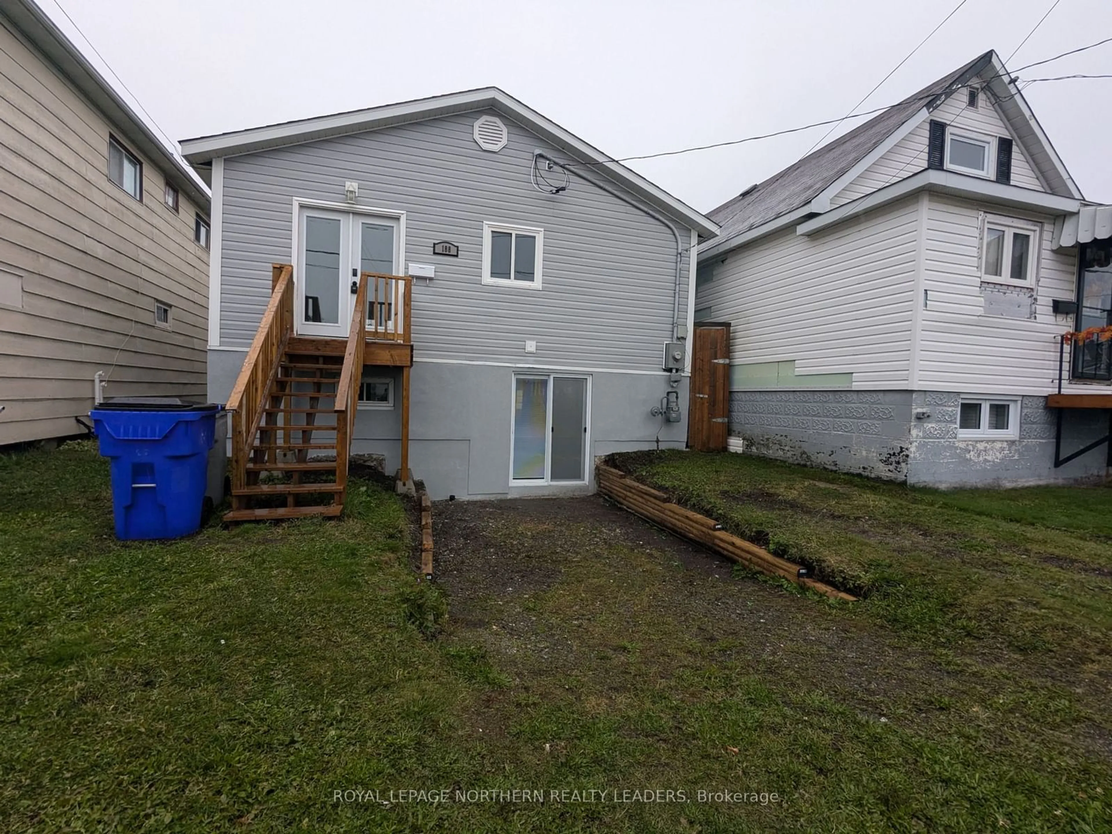 Frontside or backside of a home, the fenced backyard for 188 Birch St, Timmins Ontario P4N 6E2