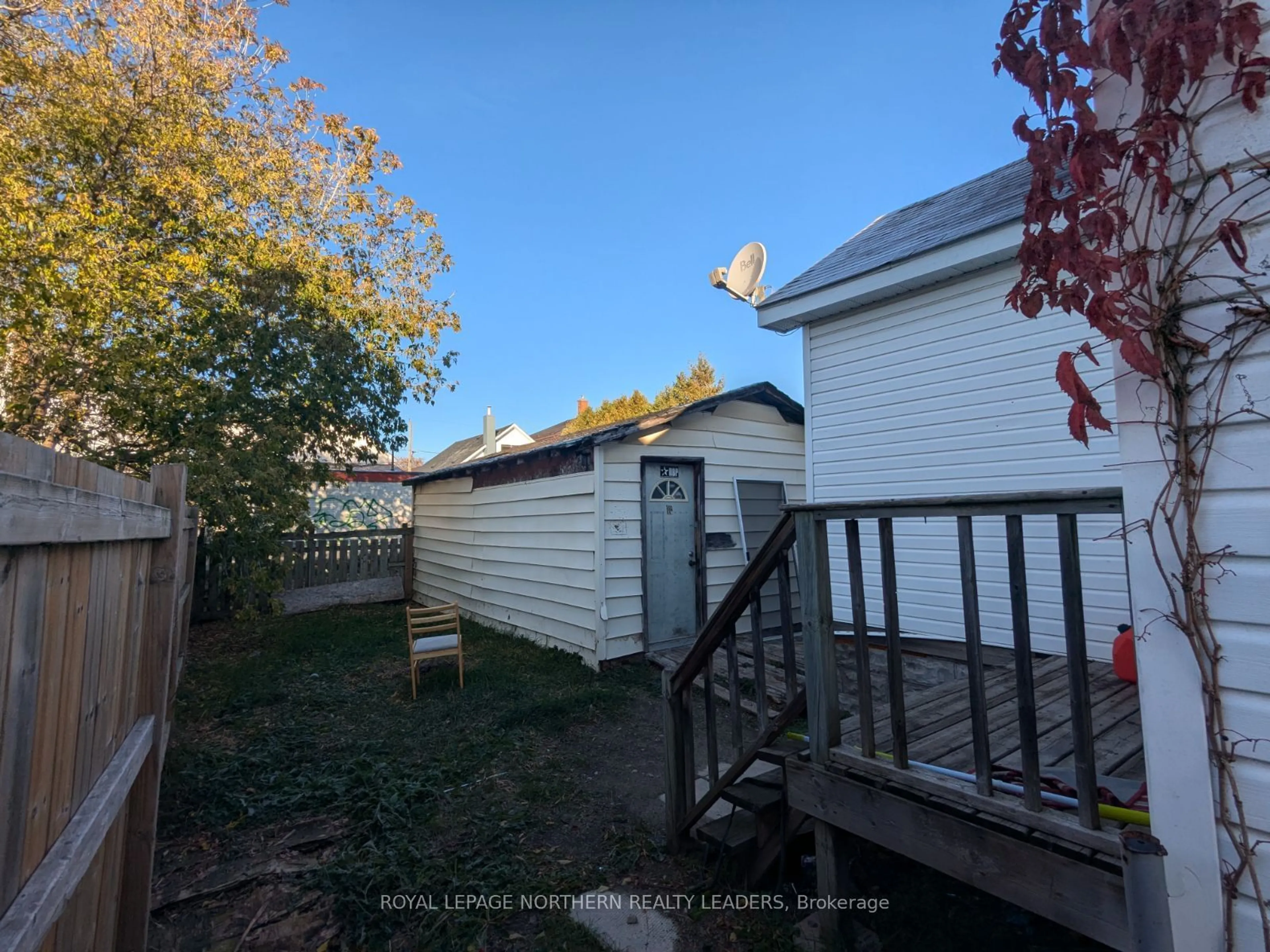 Frontside or backside of a home, the fenced backyard for 283 Maple St, Timmins Ontario P4N 1Z3