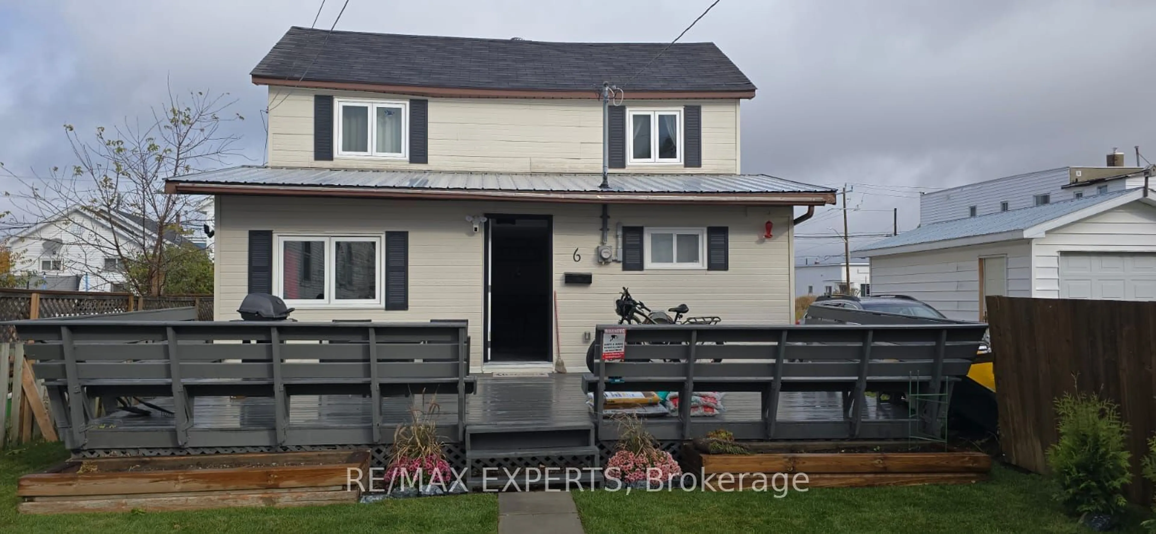 Frontside or backside of a home, the fenced backyard for 6 Teck Ave, Kirkland Lake Ontario P2N 2X4