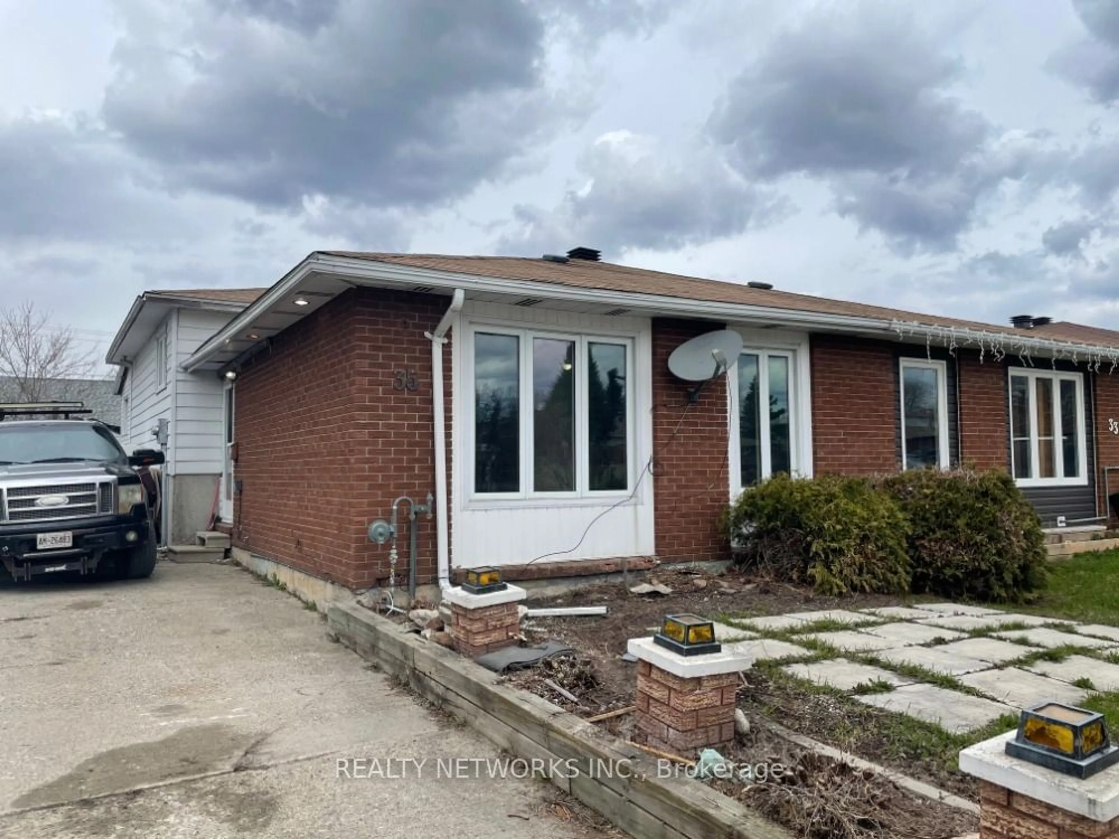 Frontside or backside of a home, the front or back of building for 35 Graham Lane, Timmins Ontario P4N 7Z5