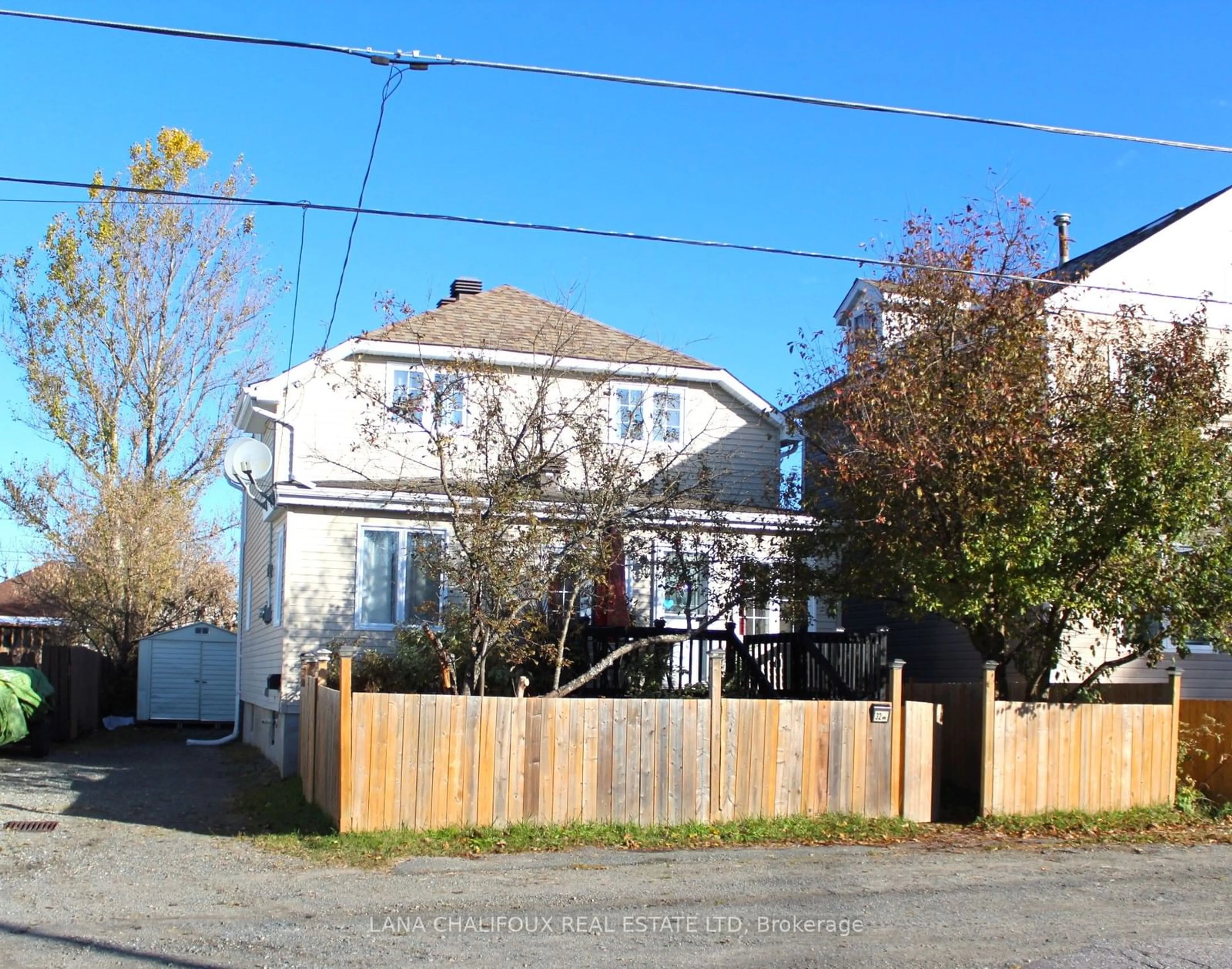 Frontside or backside of a home, the fenced backyard for 32 Rand Ave, Kirkland Lake Ontario P2N 2S9