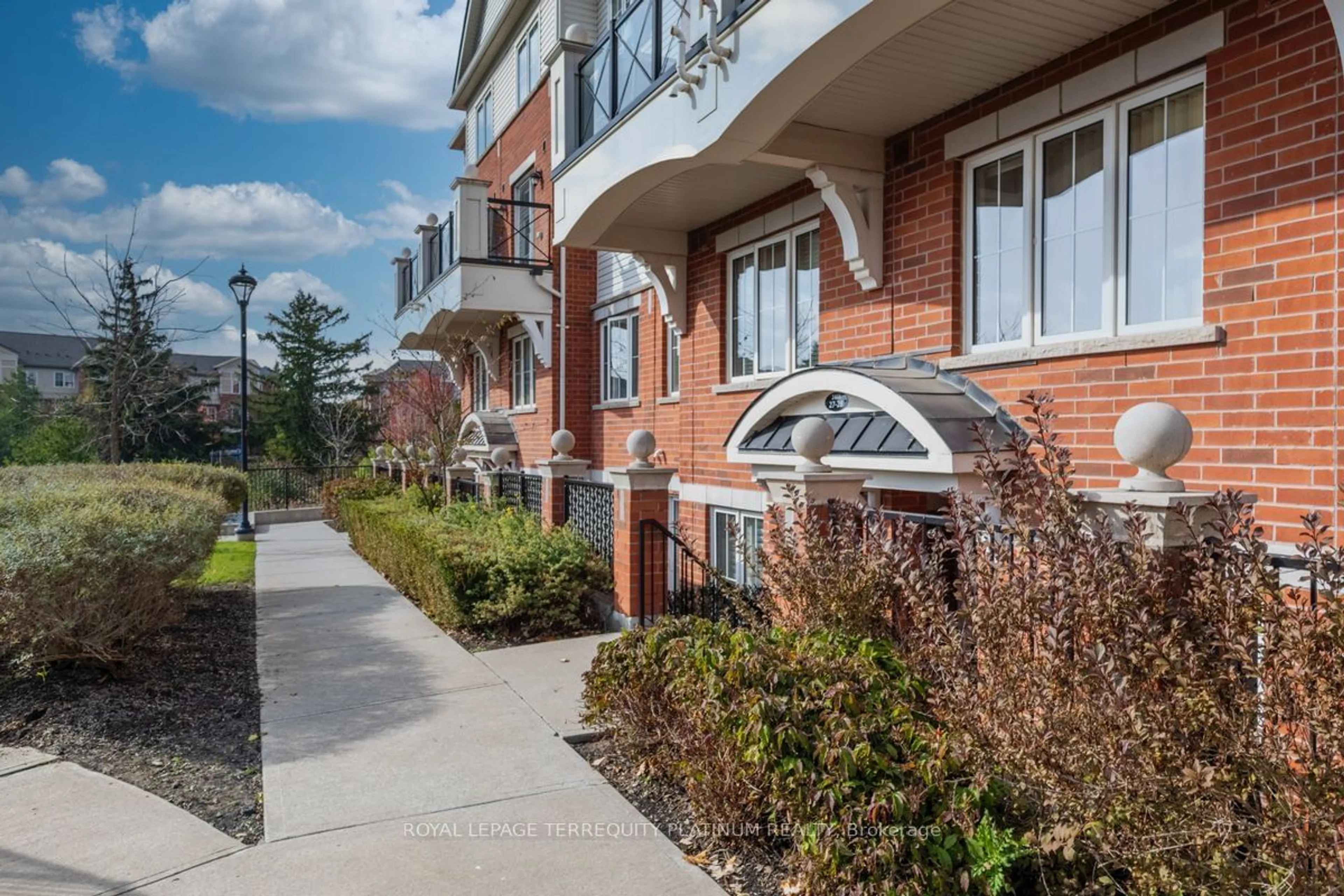 A pic from exterior of the house or condo, the street view for 2468 Post Rd #27, Oakville Ontario L6H 0J2