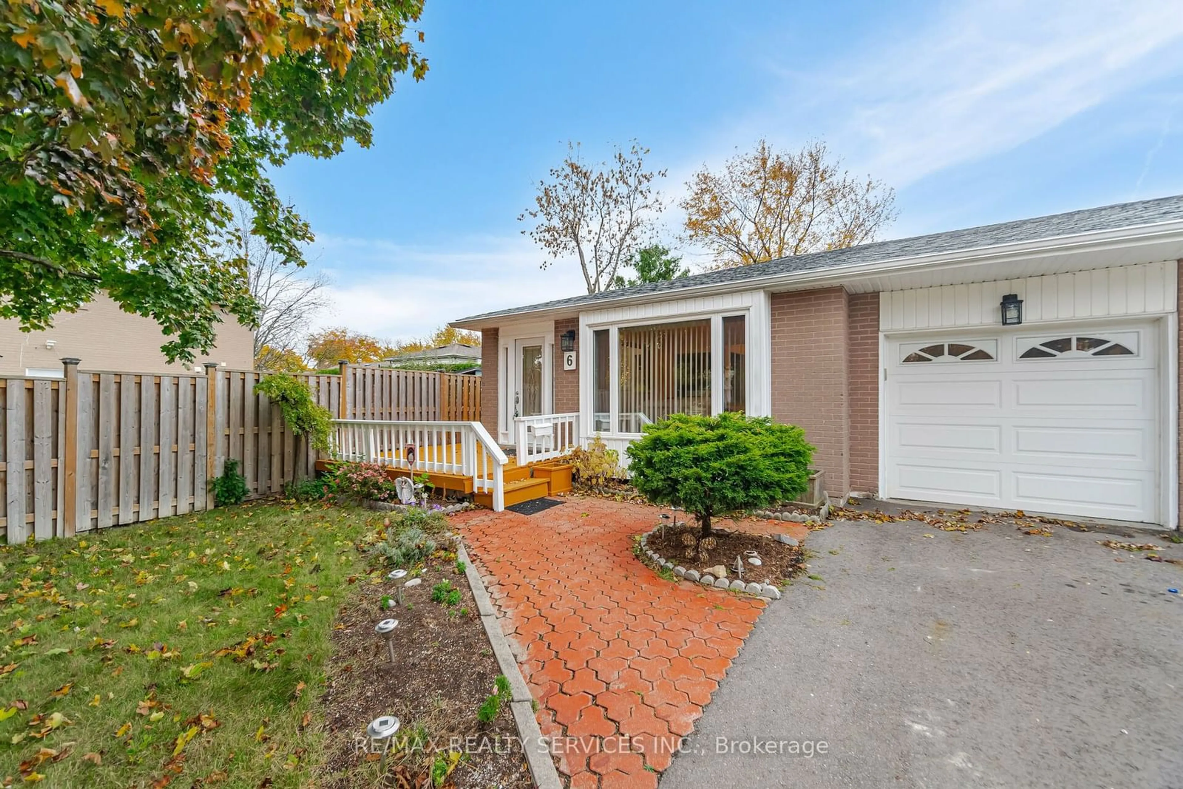 A pic from exterior of the house or condo, the fenced backyard for 6 Glenmore Cres, Brampton Ontario L6S 1H8