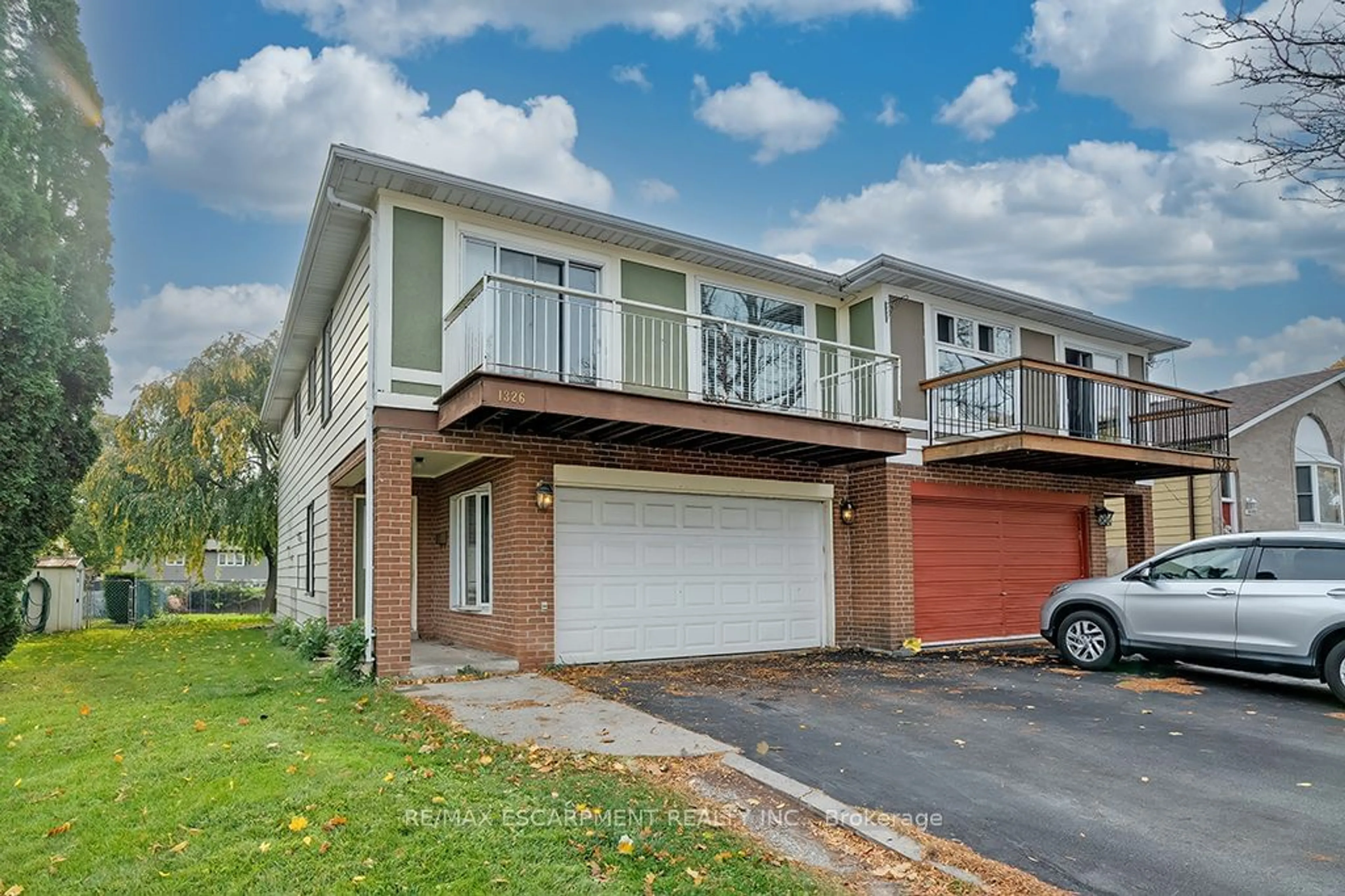 A pic from exterior of the house or condo, the fenced backyard for 1326 Consort Cres, Burlington Ontario L7M 1J7