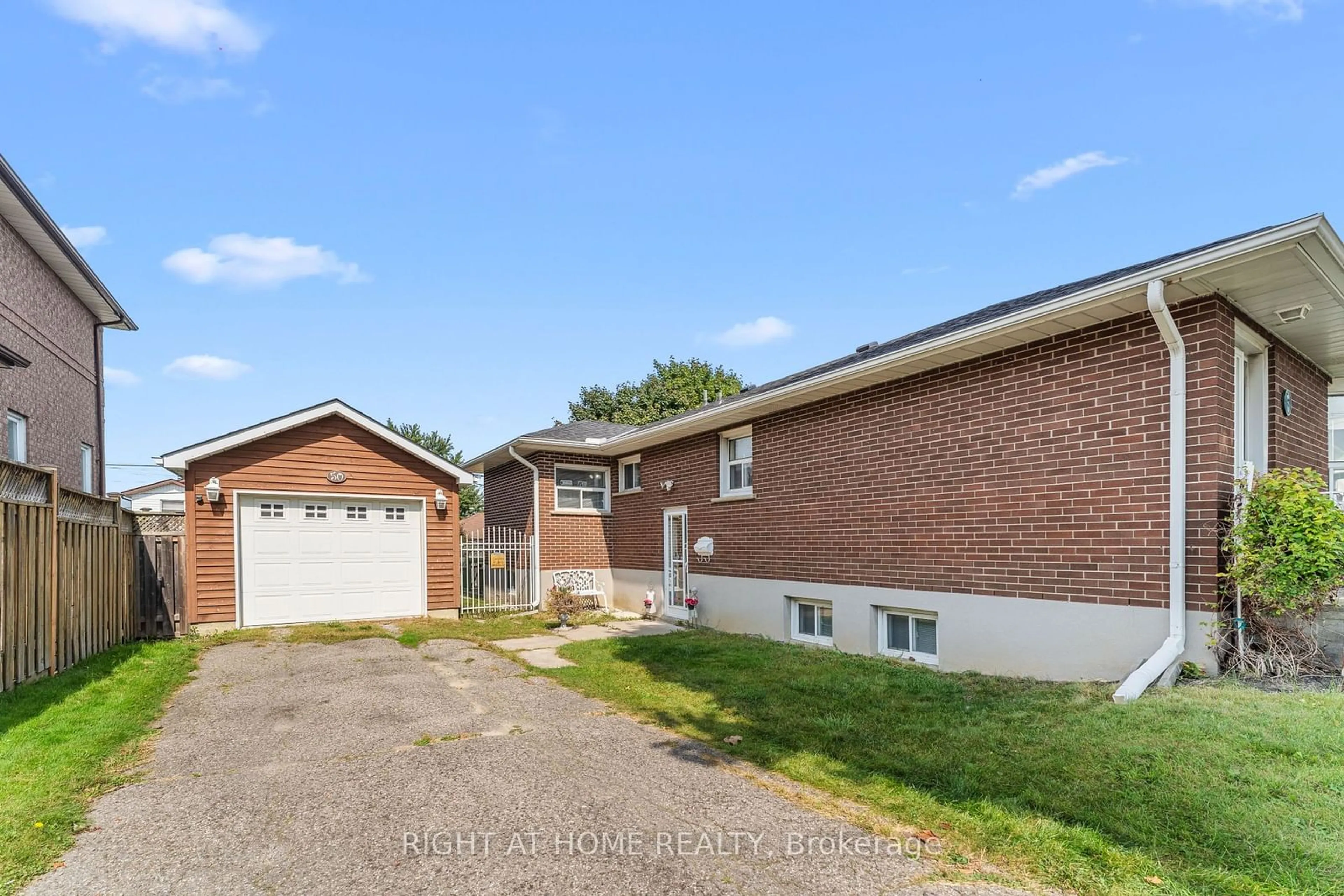 Frontside or backside of a home, the street view for 50 Lilac Ave, Toronto Ontario M9M 1G3