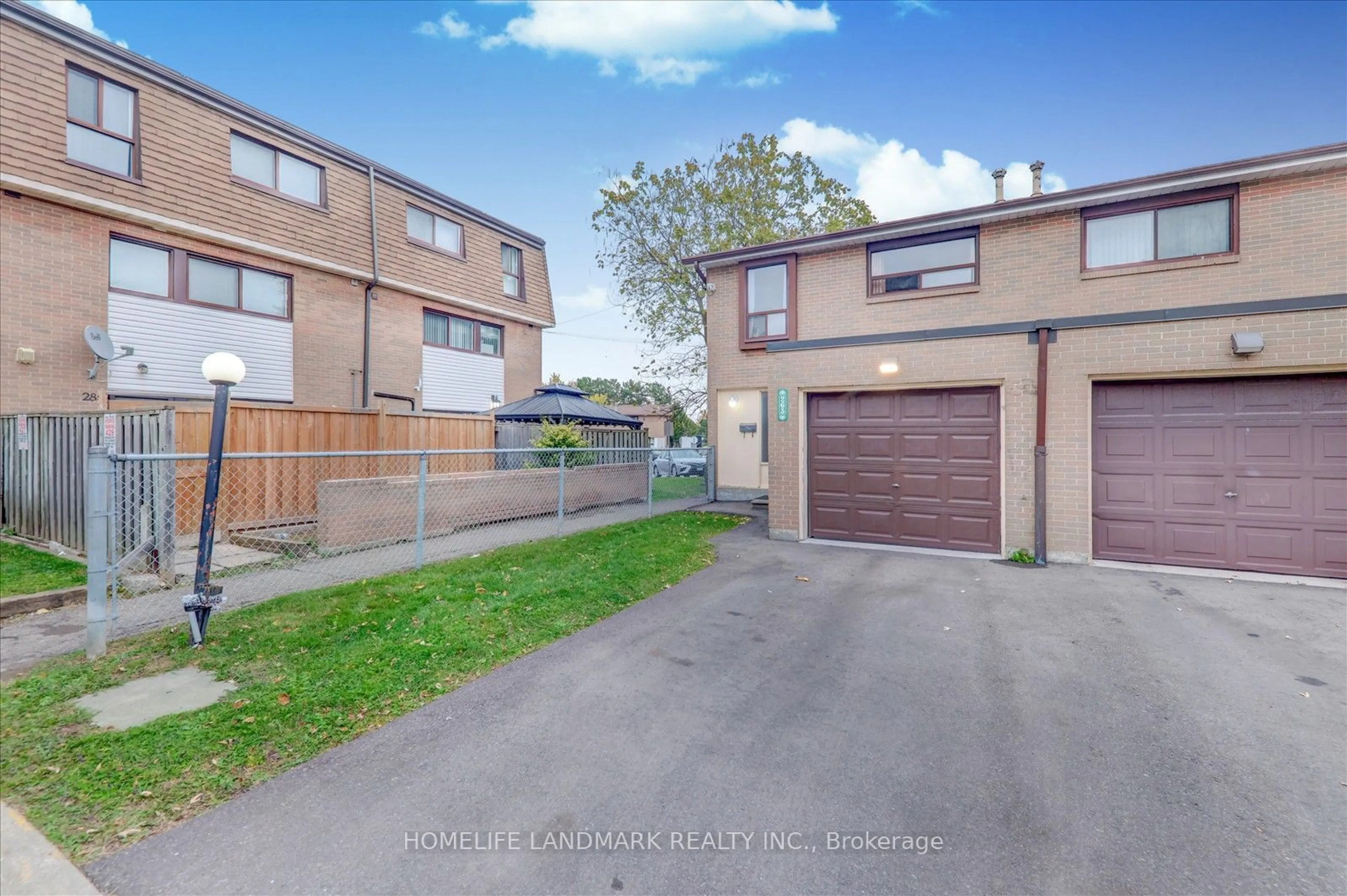 A pic from exterior of the house or condo, the fenced backyard for 263 Fleetwood Cres, Brampton Ontario L6T 2E7