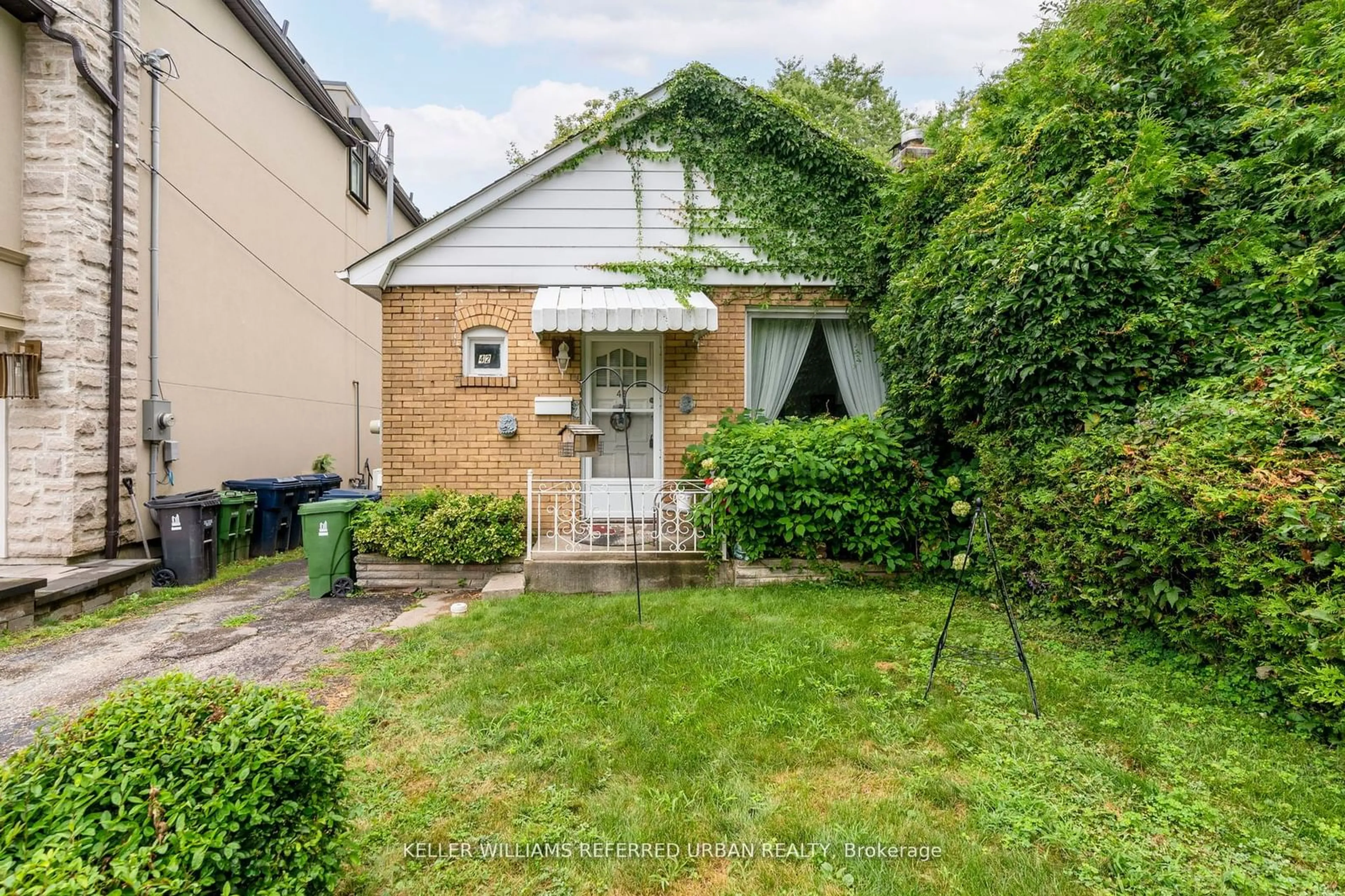 Frontside or backside of a home, the fenced backyard for 42 Thirty Eighth St, Toronto Ontario M8W 3L9