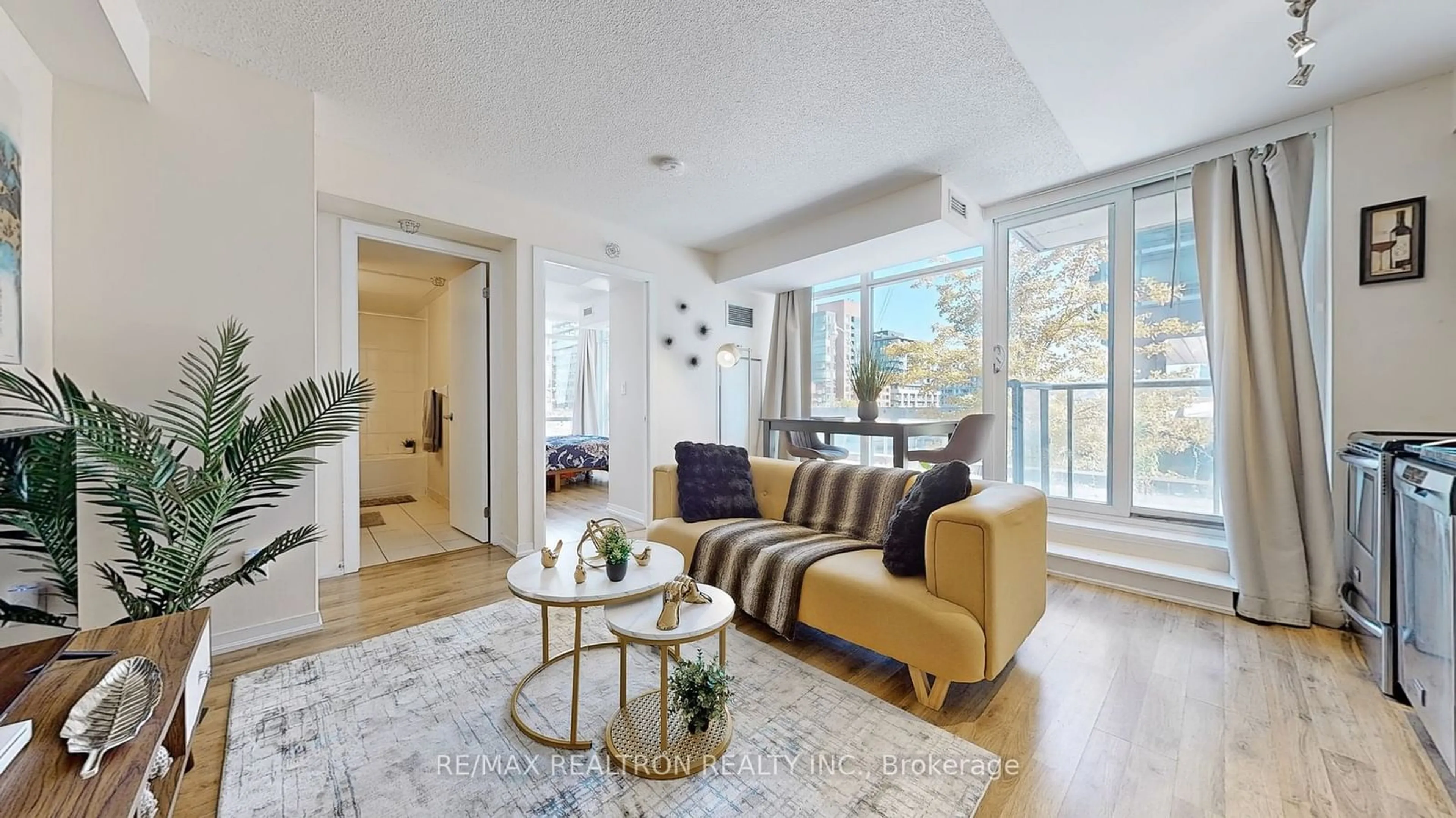 Living room, wood floors for 20 Joe Shuster Way #202, Toronto Ontario M6K 0A3