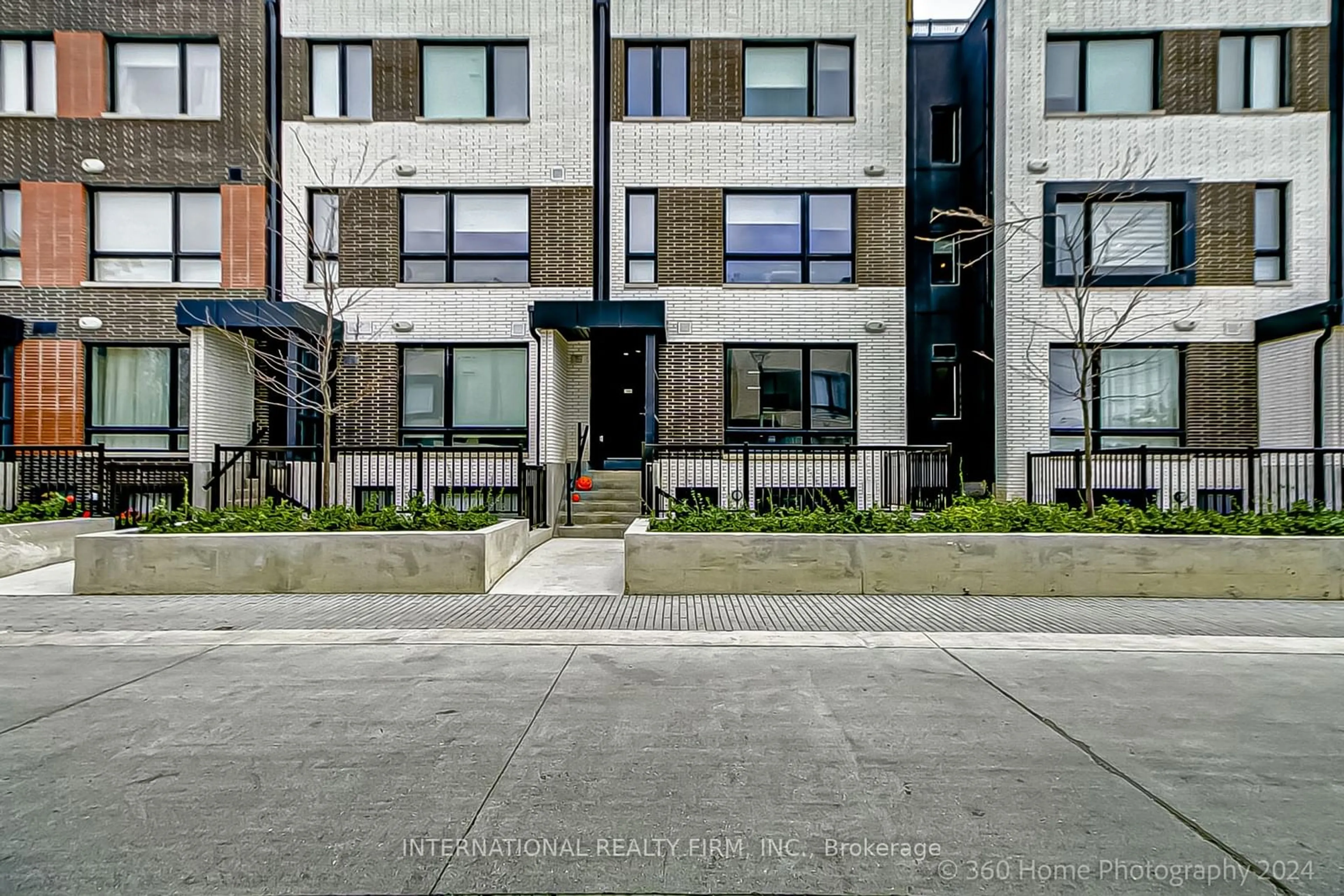 A pic from exterior of the house or condo, the street view for 40 Ed Clark Gardens Blvd #TH19, Toronto Ontario M6N 0C1