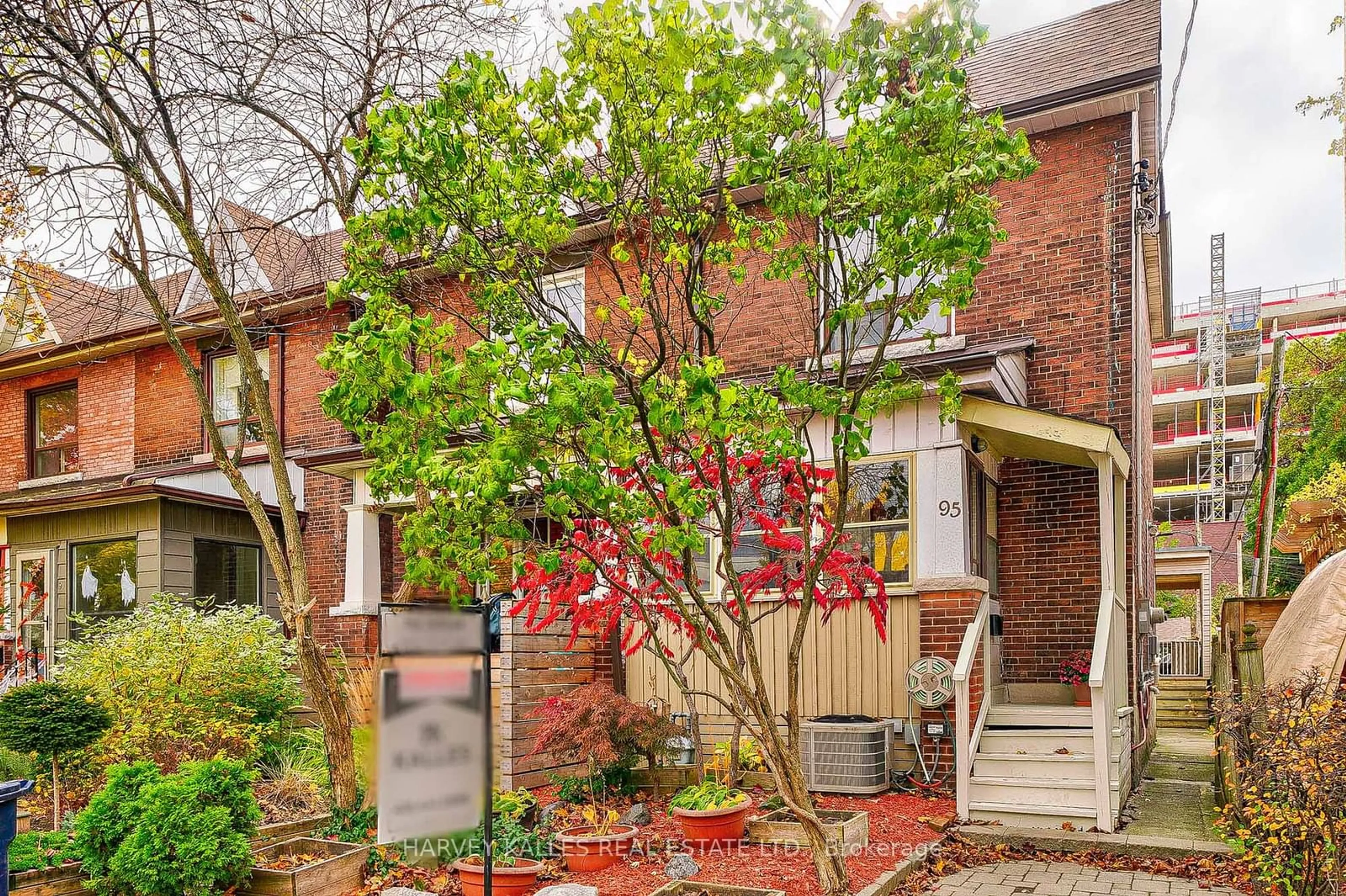 A pic from exterior of the house or condo, the fenced backyard for 95 Vine Ave, Toronto Ontario M6P 1V8