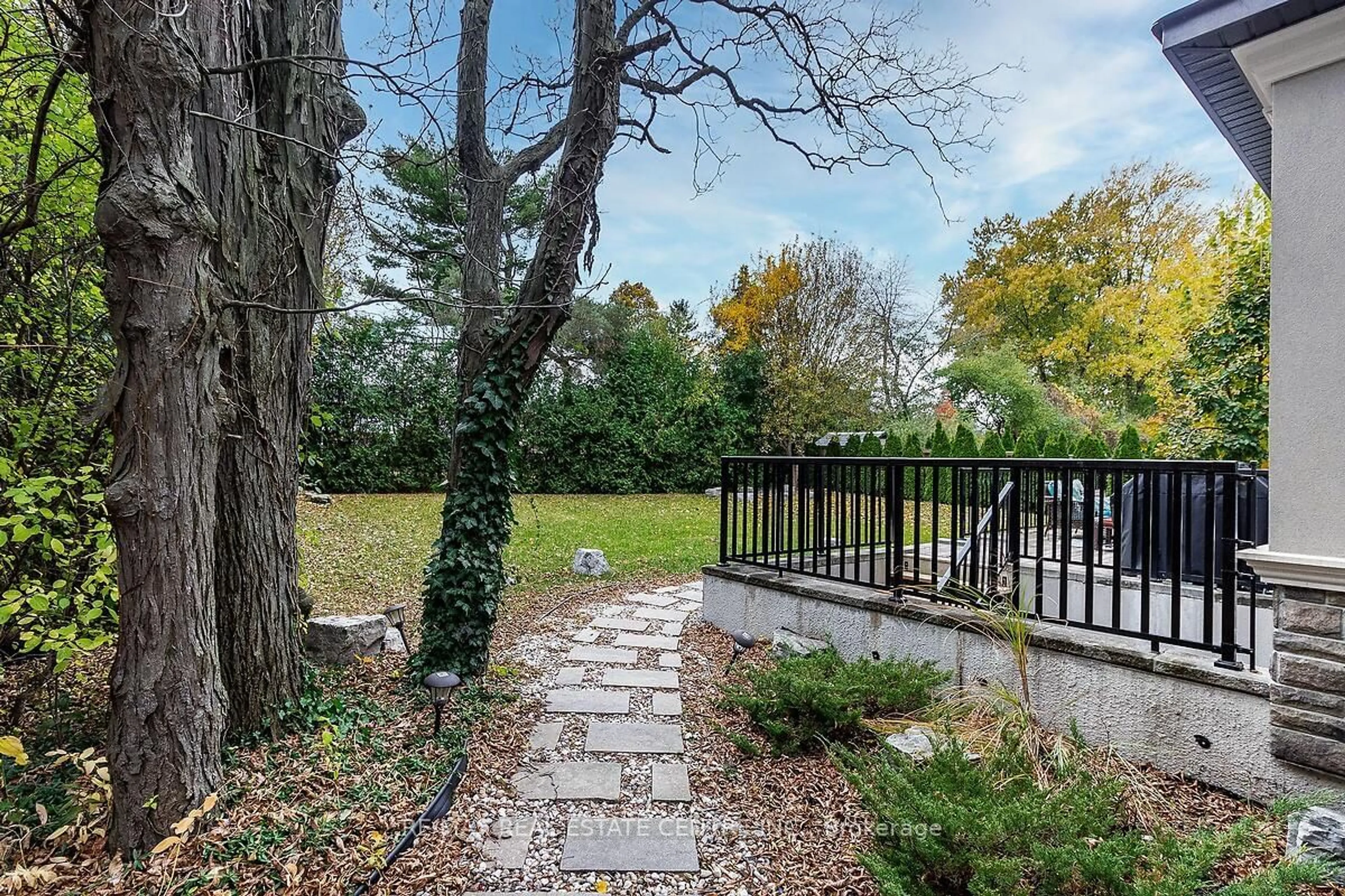 Patio, the fenced backyard for 228 Tweedsdale Cres, Oakville Ontario L6L 4P7