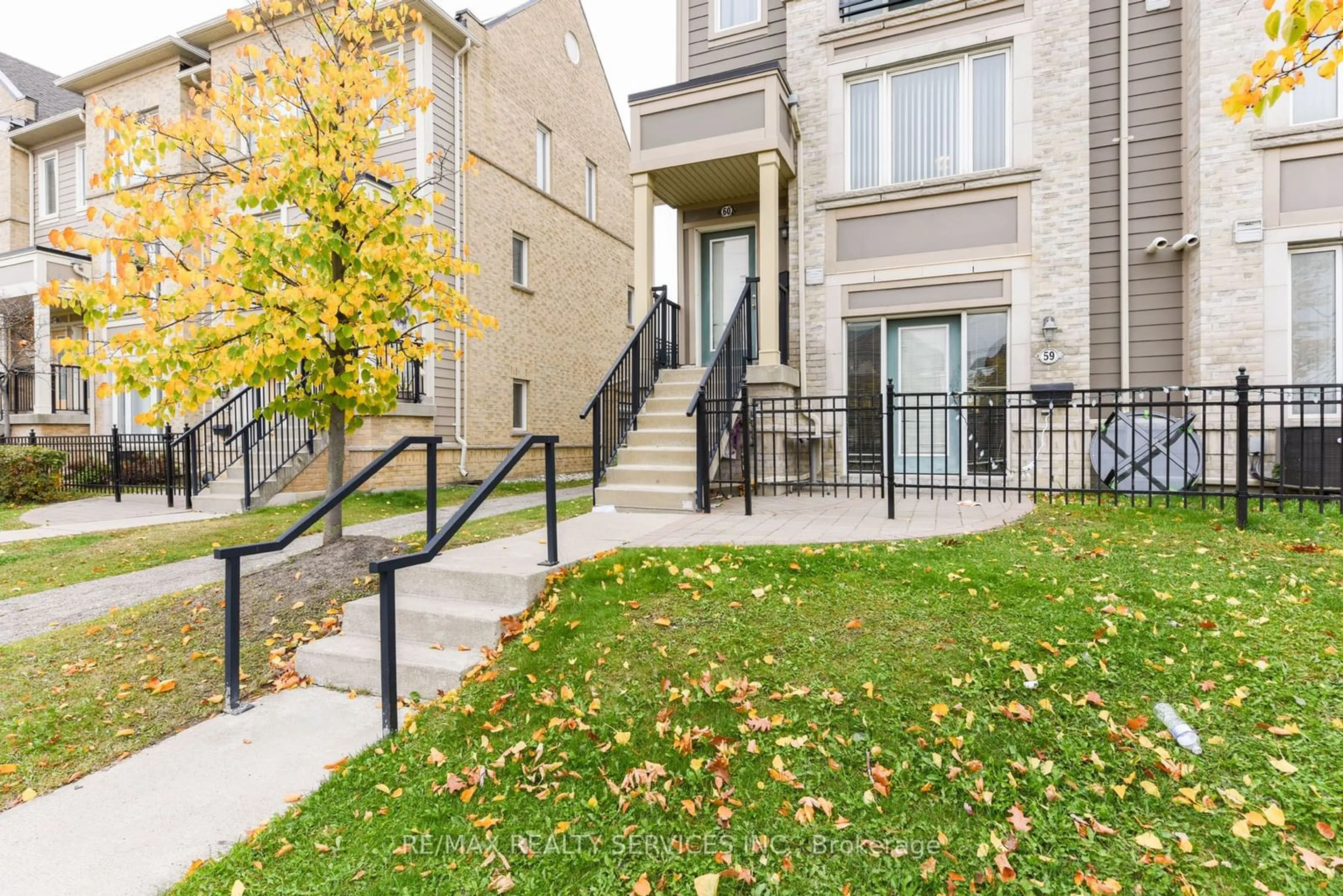 A pic from exterior of the house or condo, the fenced backyard for 60 Fairwood Circ #60, Brampton Ontario L6R 0Y6