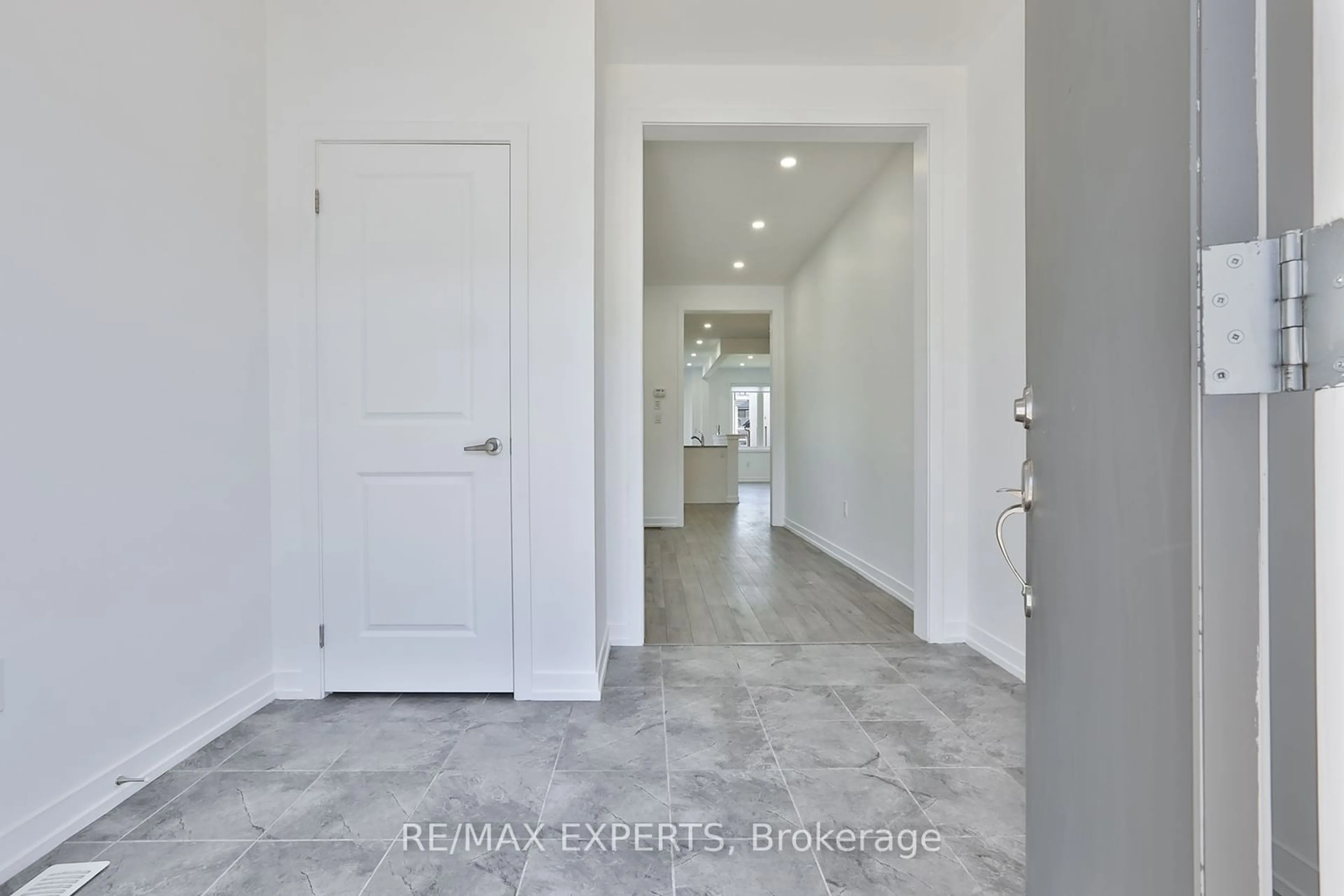 Indoor entryway, cement floor for 1541 Rose Way, Milton Ontario L9E 1V7