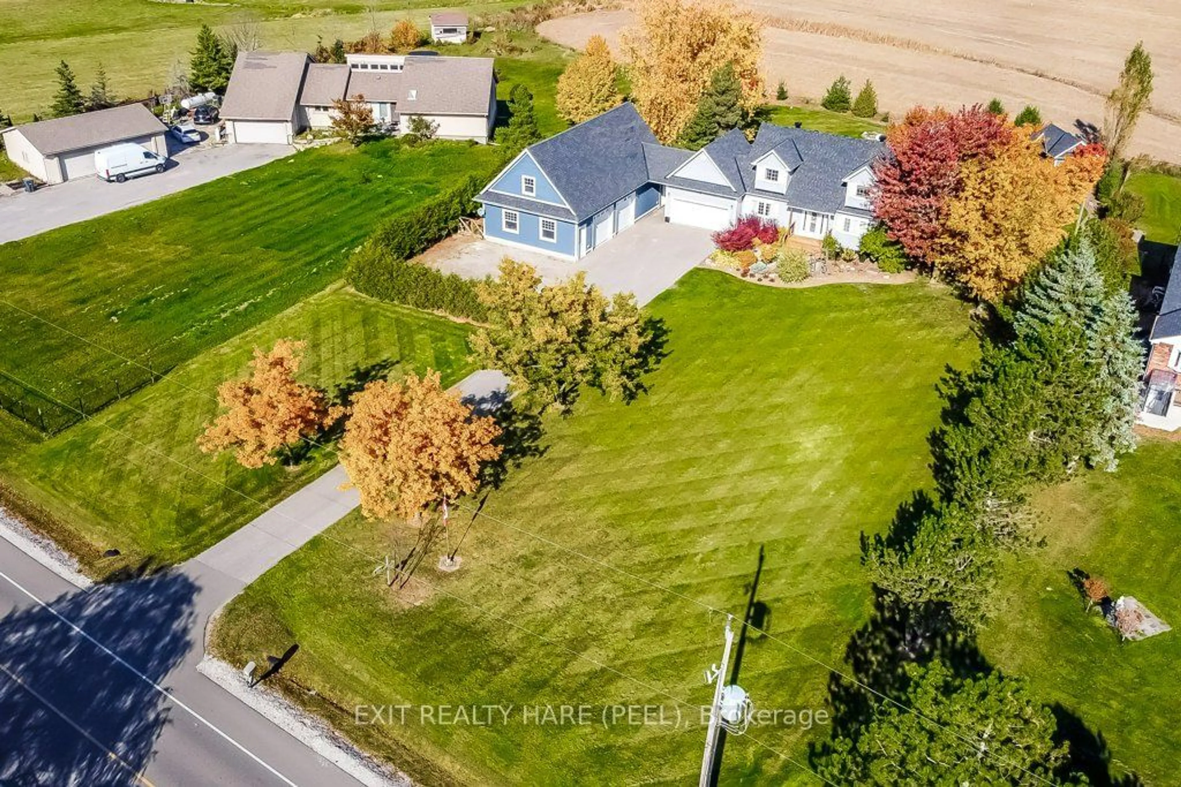 Frontside or backside of a home, the fenced backyard for 14181 Mclaughlin Rd, Caledon Ontario L7C 2B3