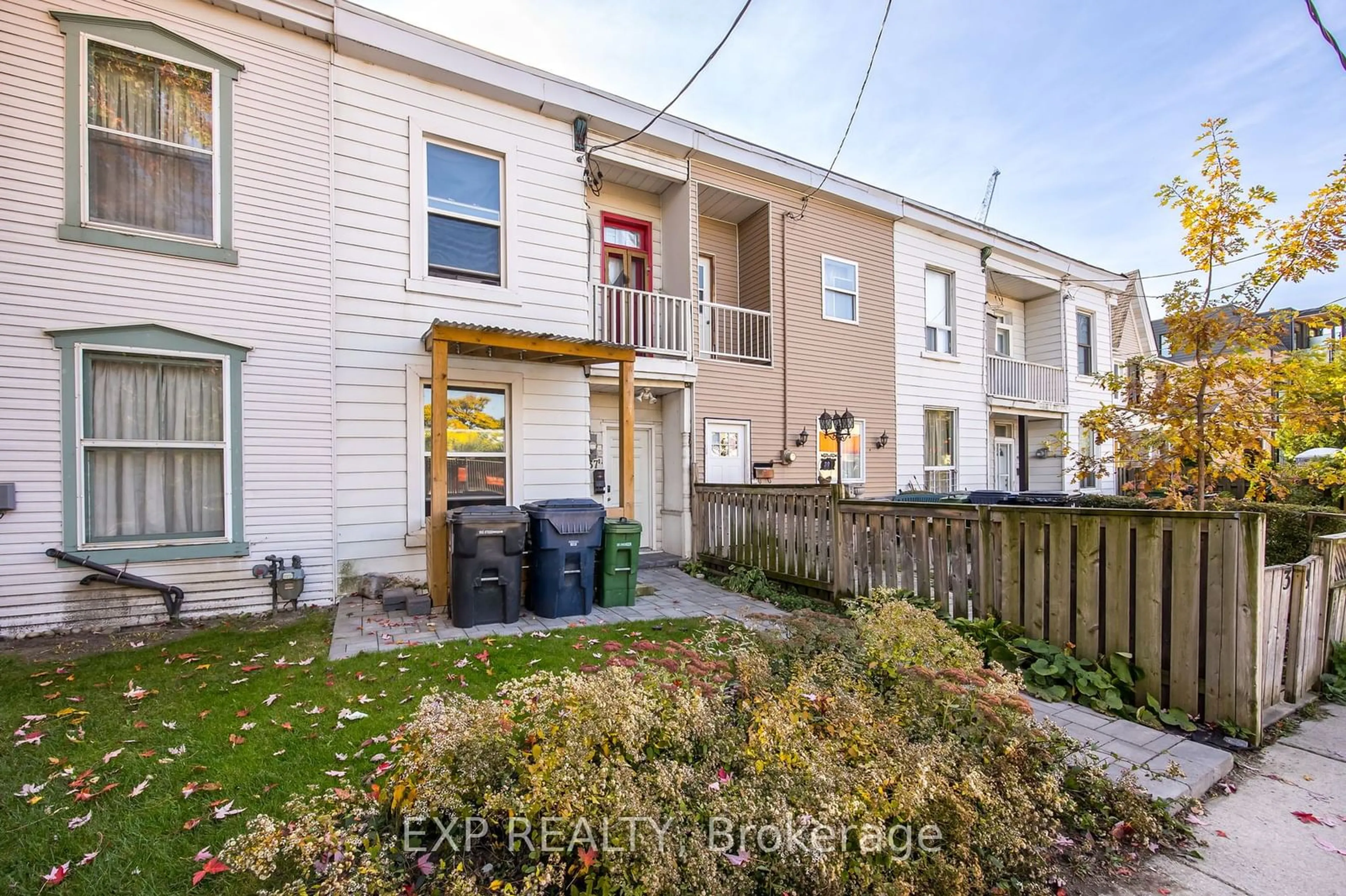 A pic from exterior of the house or condo, the fenced backyard for 37 Vine Ave, Toronto Ontario M6P 1V6