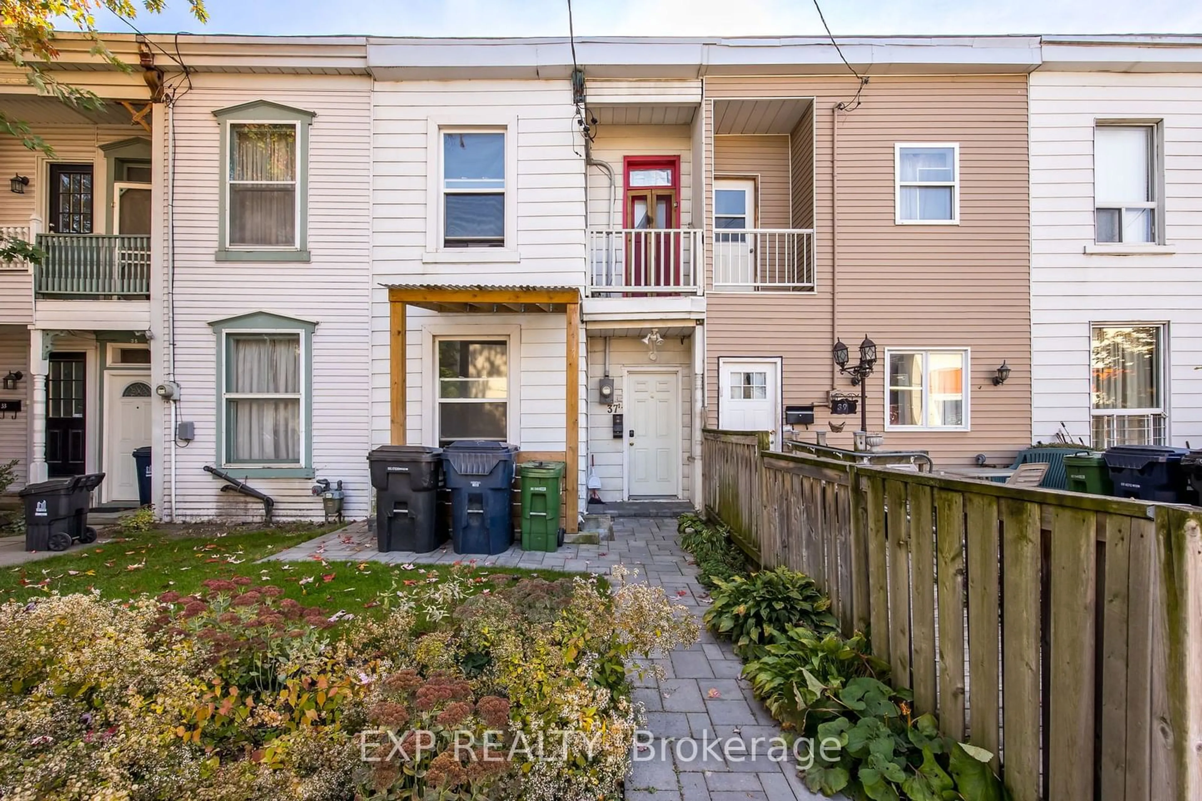 A pic from exterior of the house or condo, the fenced backyard for 37 Vine Ave, Toronto Ontario M6P 1V6