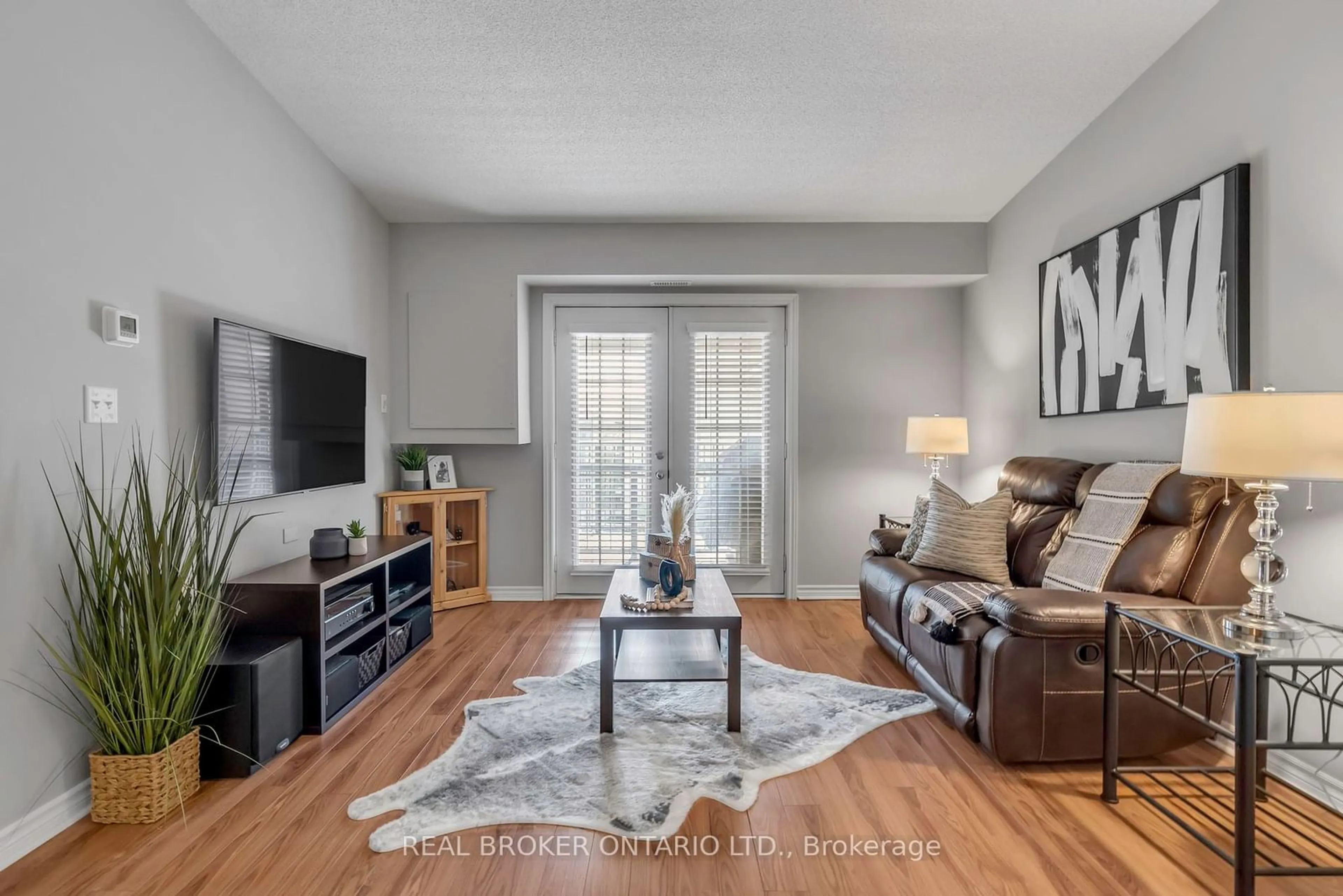 Living room, wood floors for 1340 Main St #408, Milton Ontario L9T 7S6