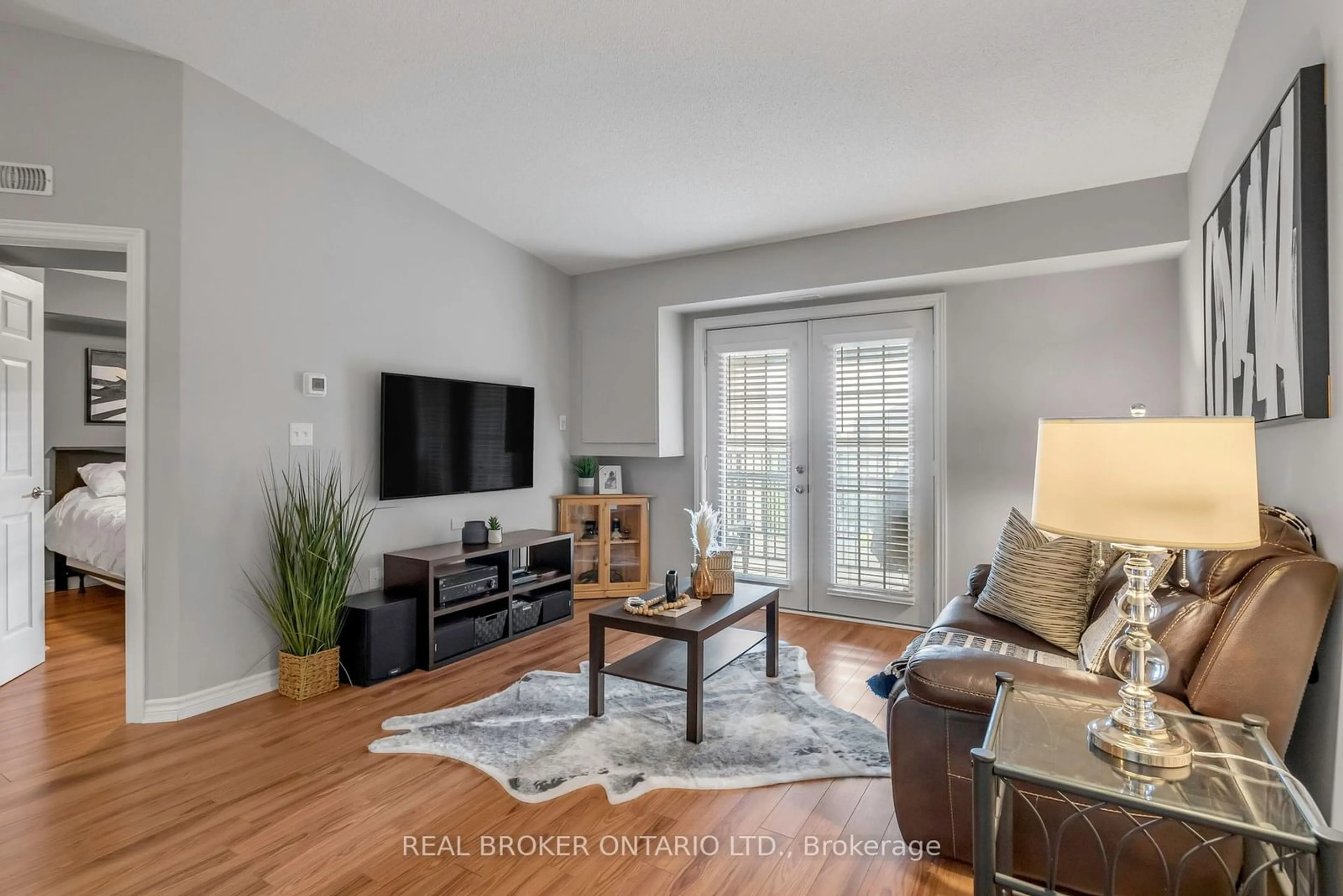 Living room, wood floors for 1340 Main St #408, Milton Ontario L9T 7S6