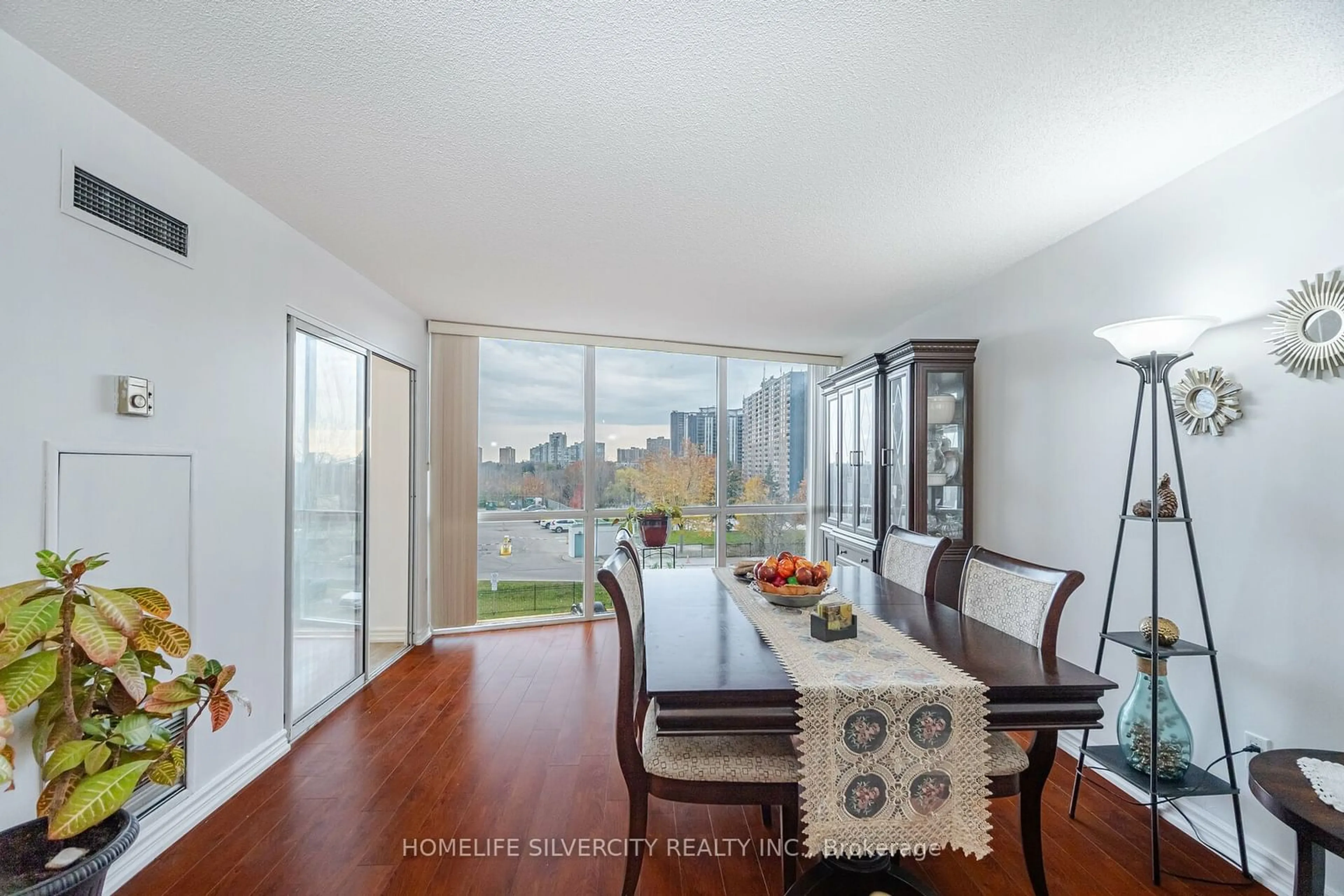 Dining room, wood floors, the view of lake or river for 21 Markbrook Lane #407, Toronto Ontario M9V 5E4