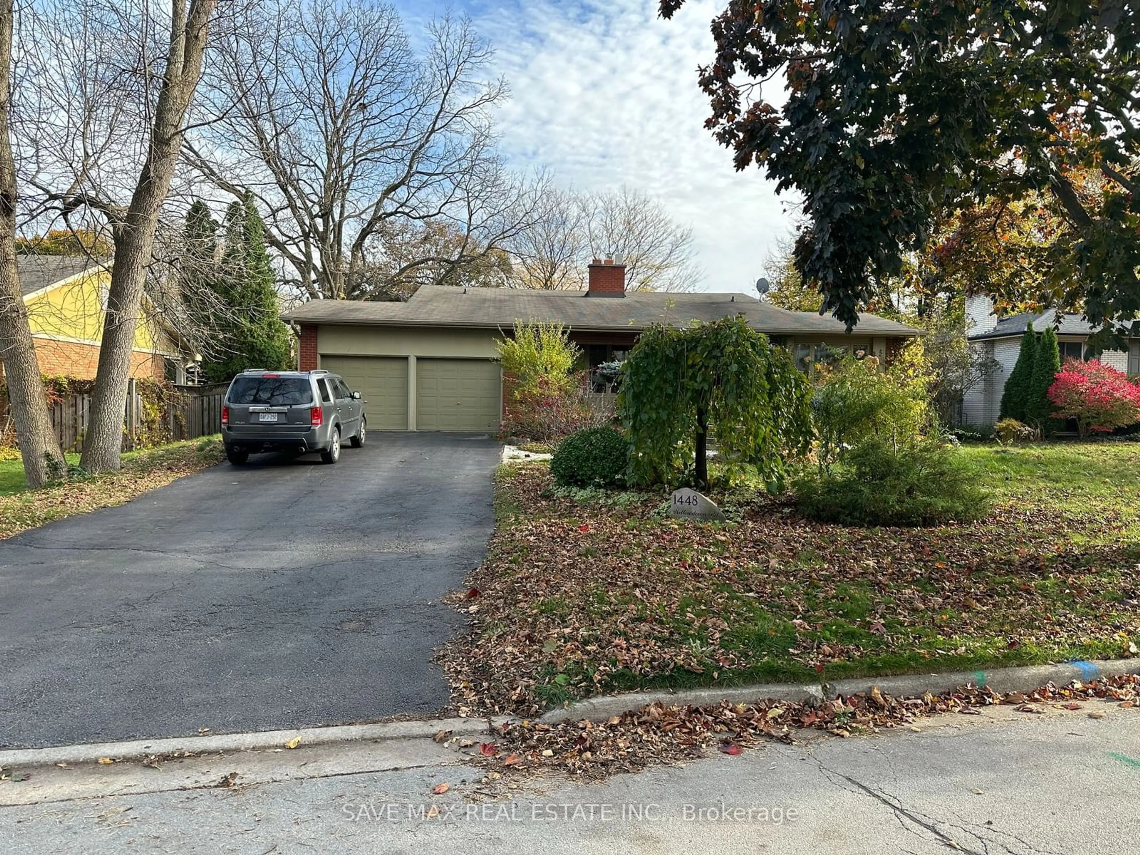 Frontside or backside of a home, the street view for 1448 Willowdown Rd, Oakville Ontario L6L 1X3