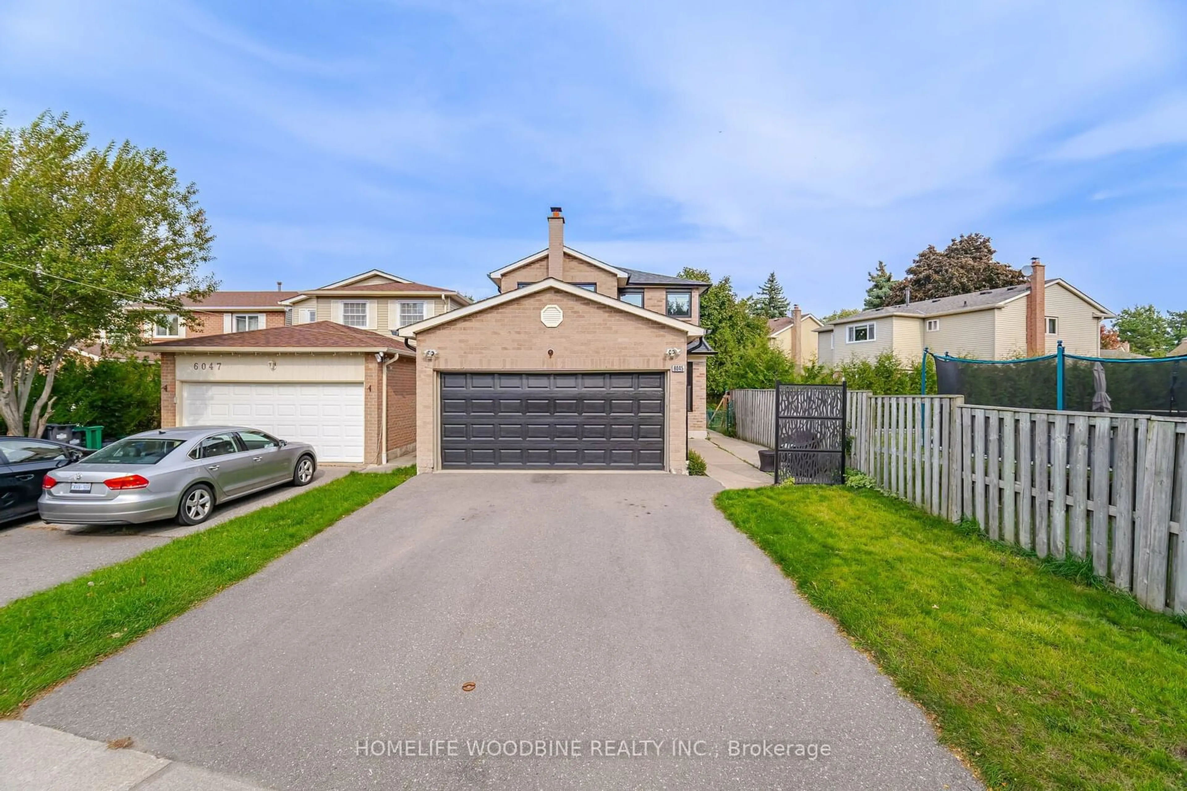 Frontside or backside of a home, the fenced backyard for 6045 Fullerton Cres, Mississauga Ontario L5N 3A3