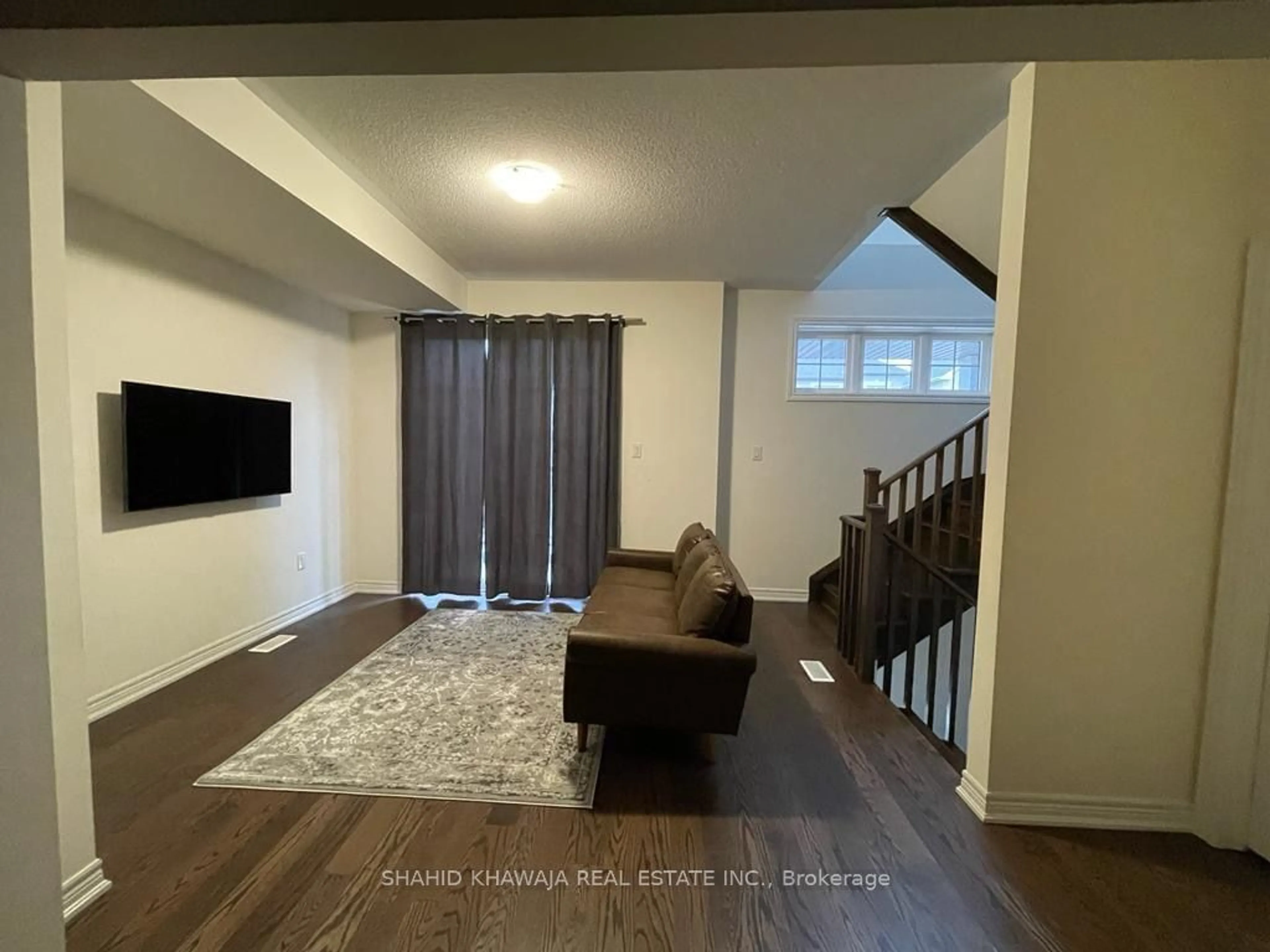 A pic of a room, wood floors for 68 Hashmi Pl, Brampton Ontario L6Y 6J9