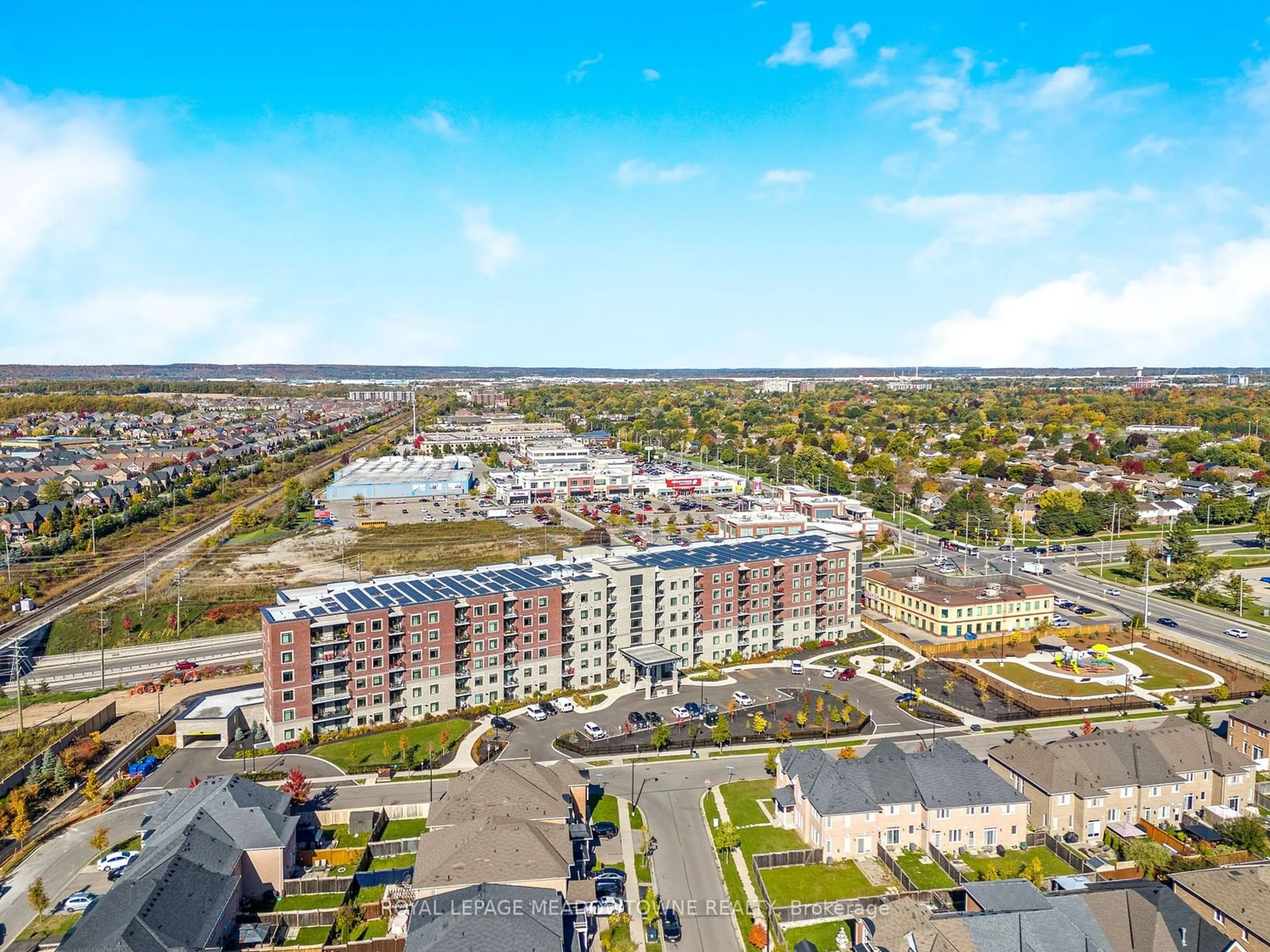 A pic from exterior of the house or condo, the view of city buildings for 830 MEGSON Terr #119, Milton Ontario L9T 9M7