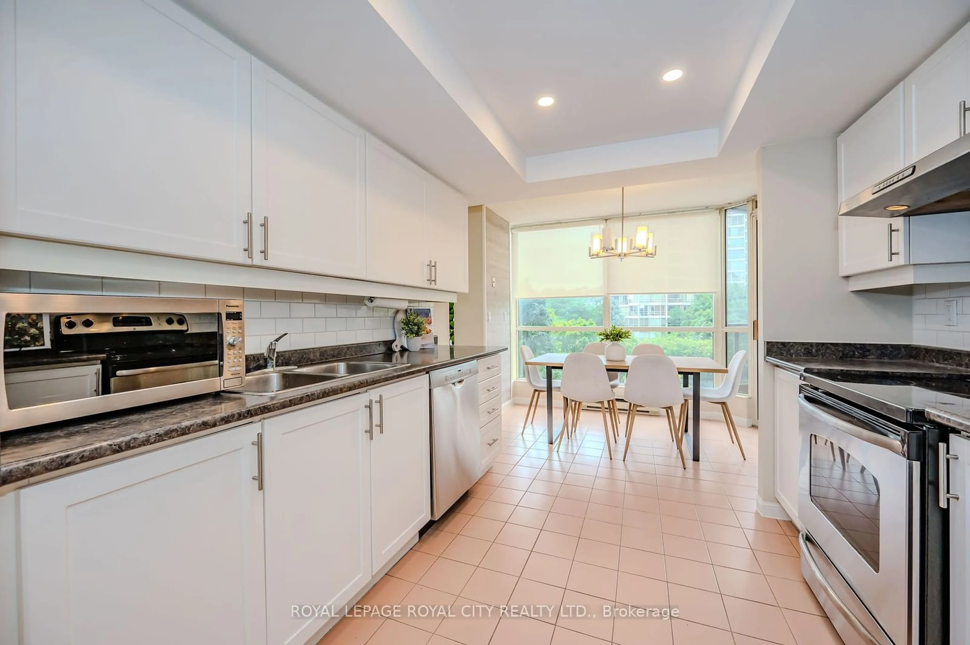 Open concept kitchen for 55 Kingsbridge Garden Circ #406, Mississauga Ontario L5R 1Y1