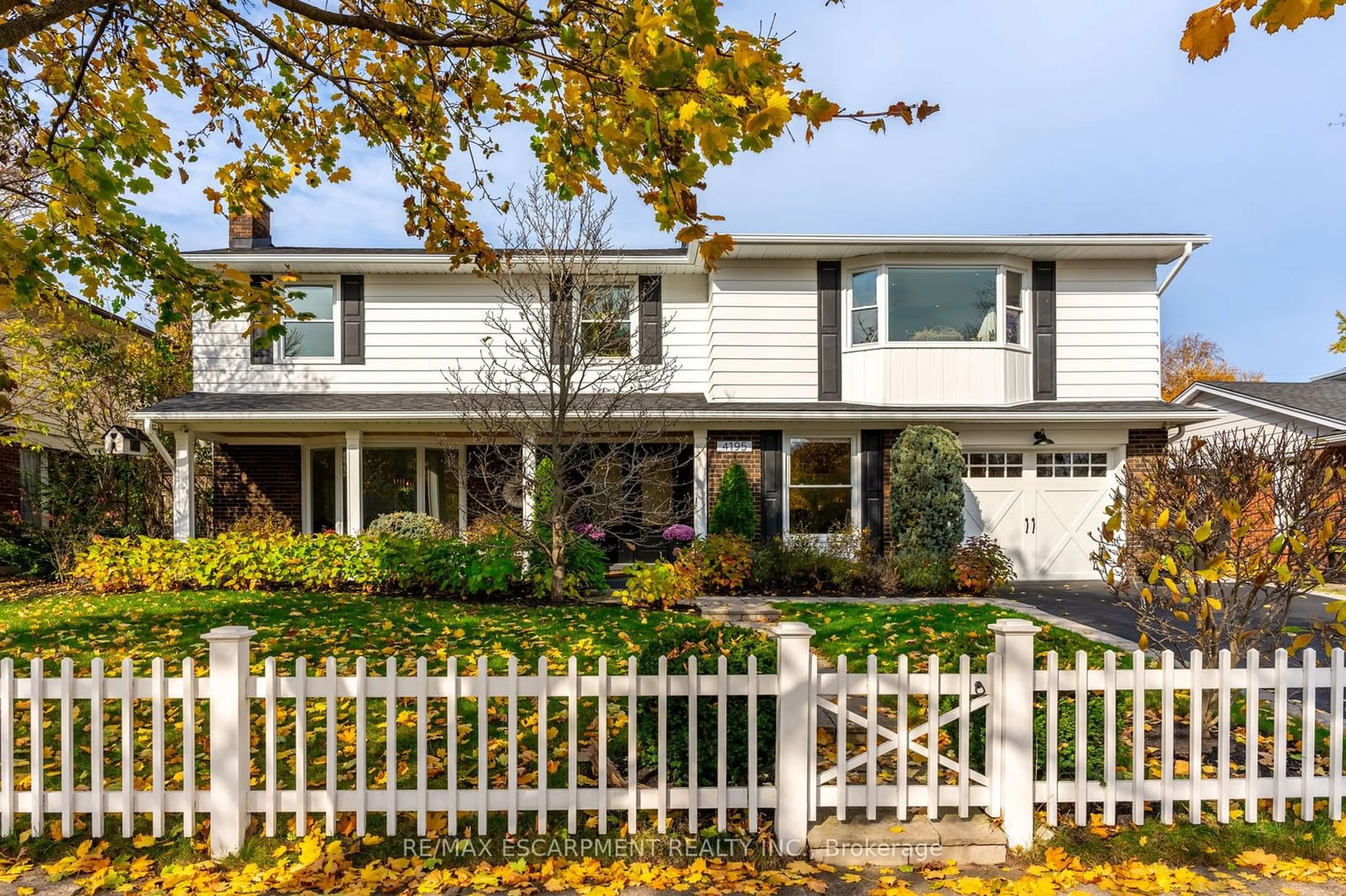 Frontside or backside of a home, the fenced backyard for 4195 Spruce Ave, Burlington Ontario L7L 1L1