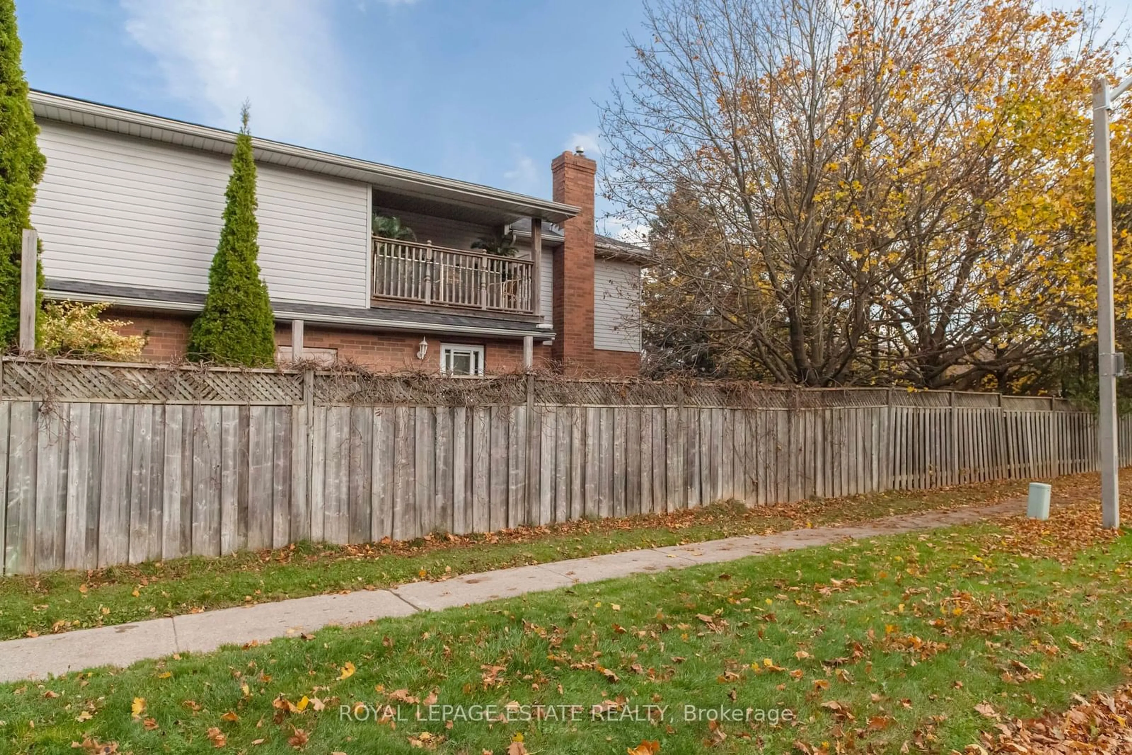 A pic from exterior of the house or condo, the fenced backyard for 30 Passmore Ave, Orangeville Ontario L9W 4K7