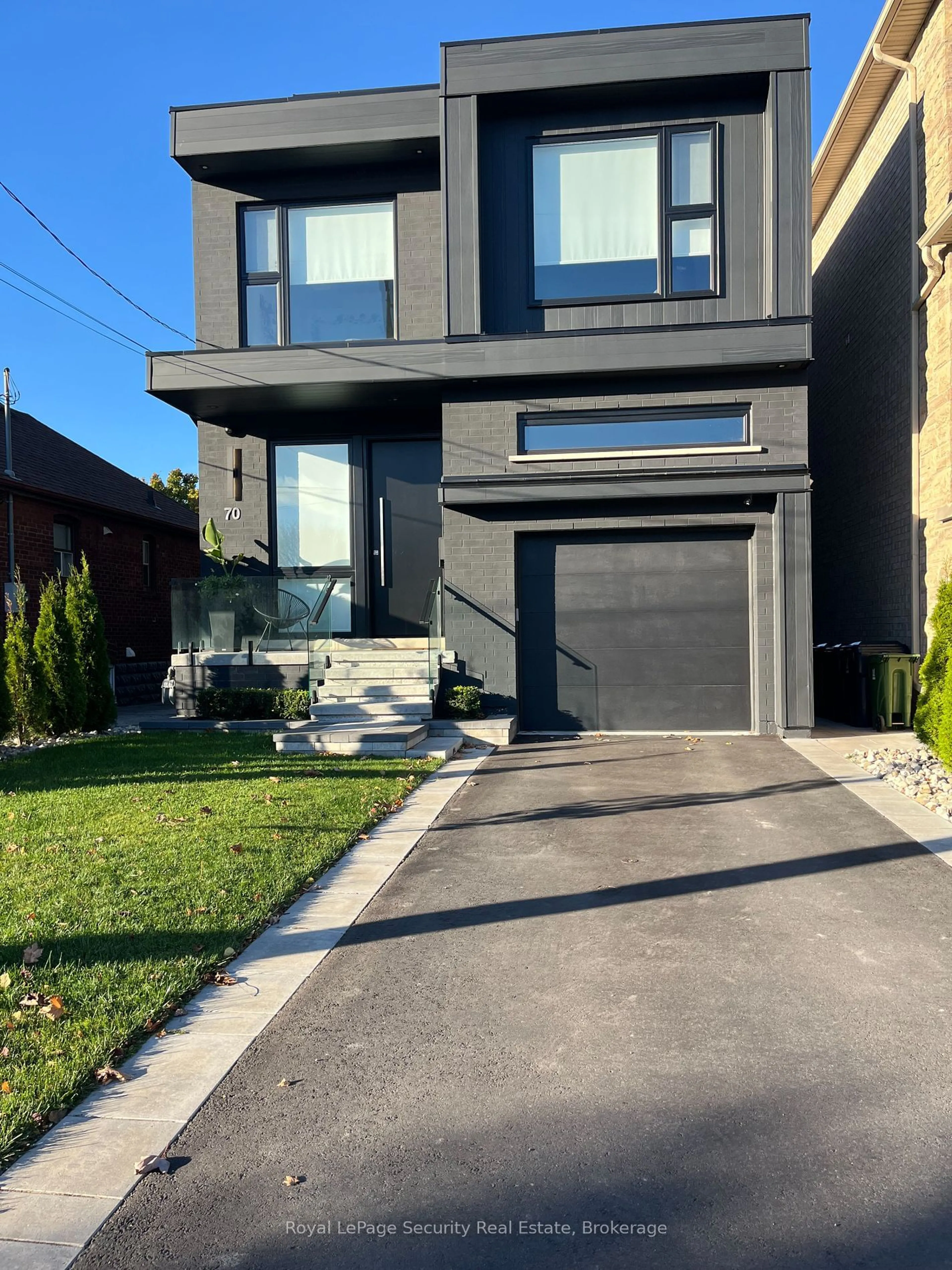 Frontside or backside of a home, the street view for 70 Chamberlain Ave, Toronto Ontario M6E 4K1