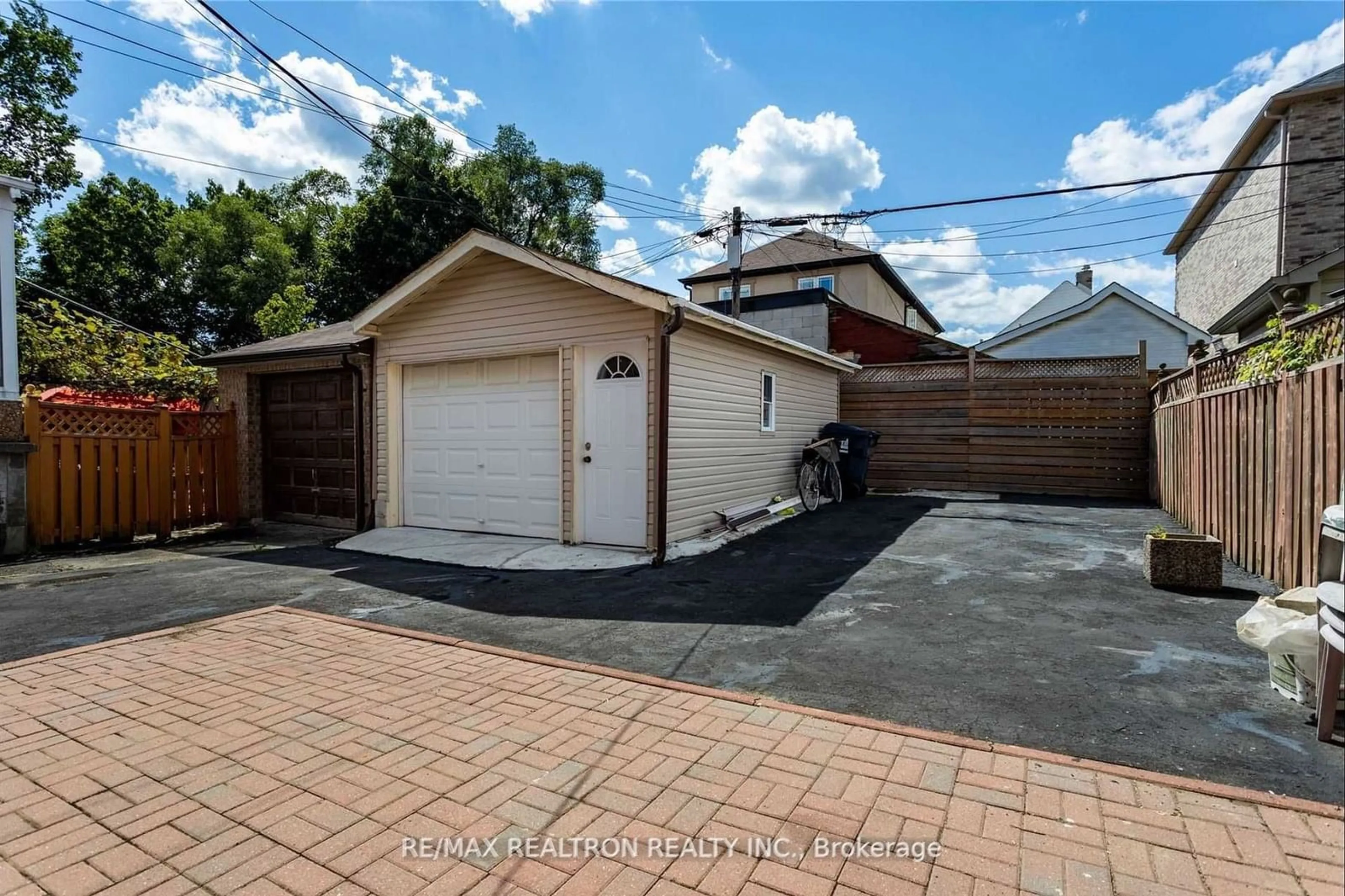 Frontside or backside of a home, the fenced backyard for 80 Gray Ave, Toronto Ontario M6N 4S8