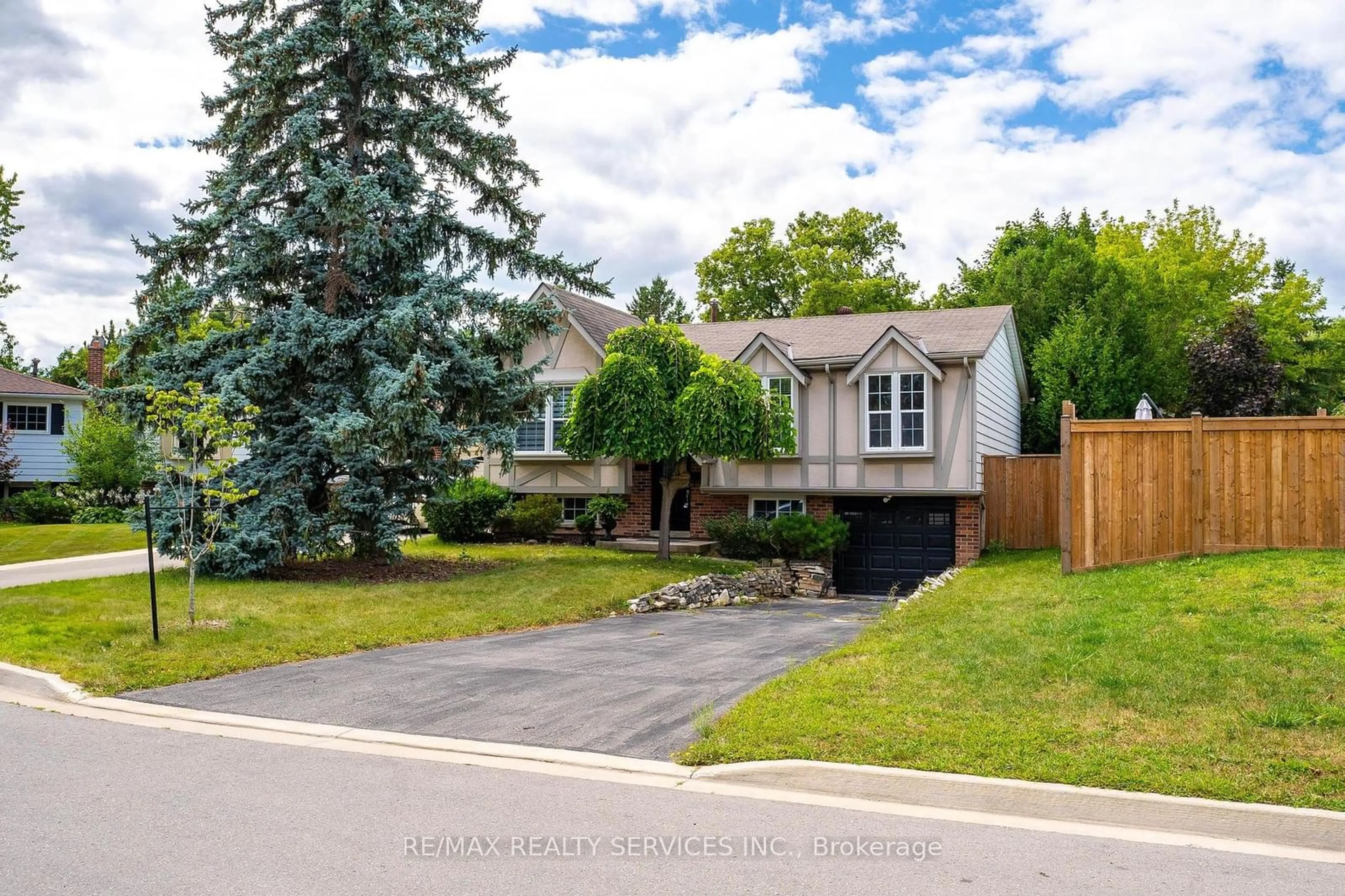 Frontside or backside of a home, the fenced backyard for 1301 Janina Blvd, Burlington Ontario L7P 1K2