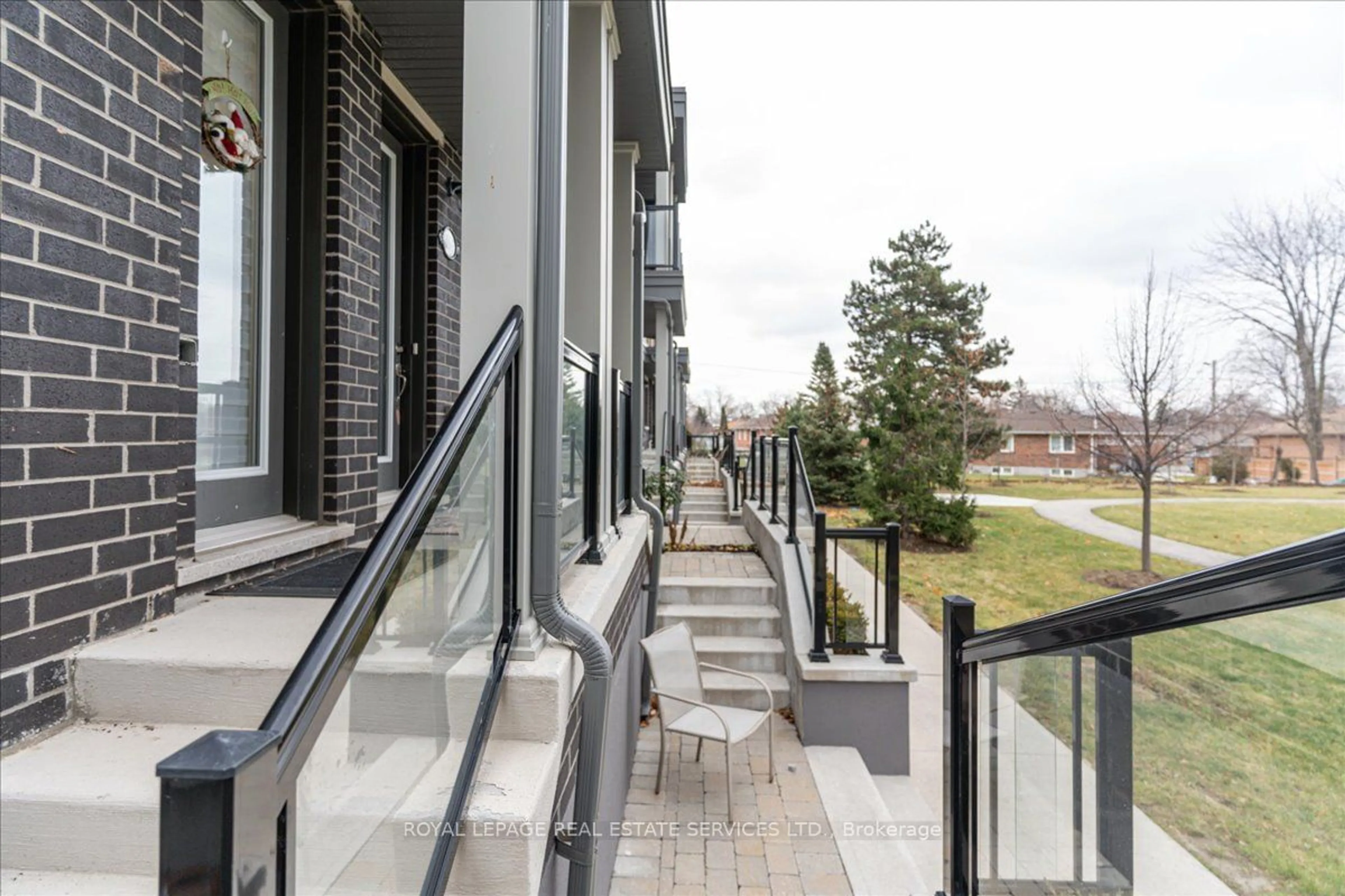 Patio, the front or back of building for 389 The Westway #TH 7, Toronto Ontario M9R 1H3