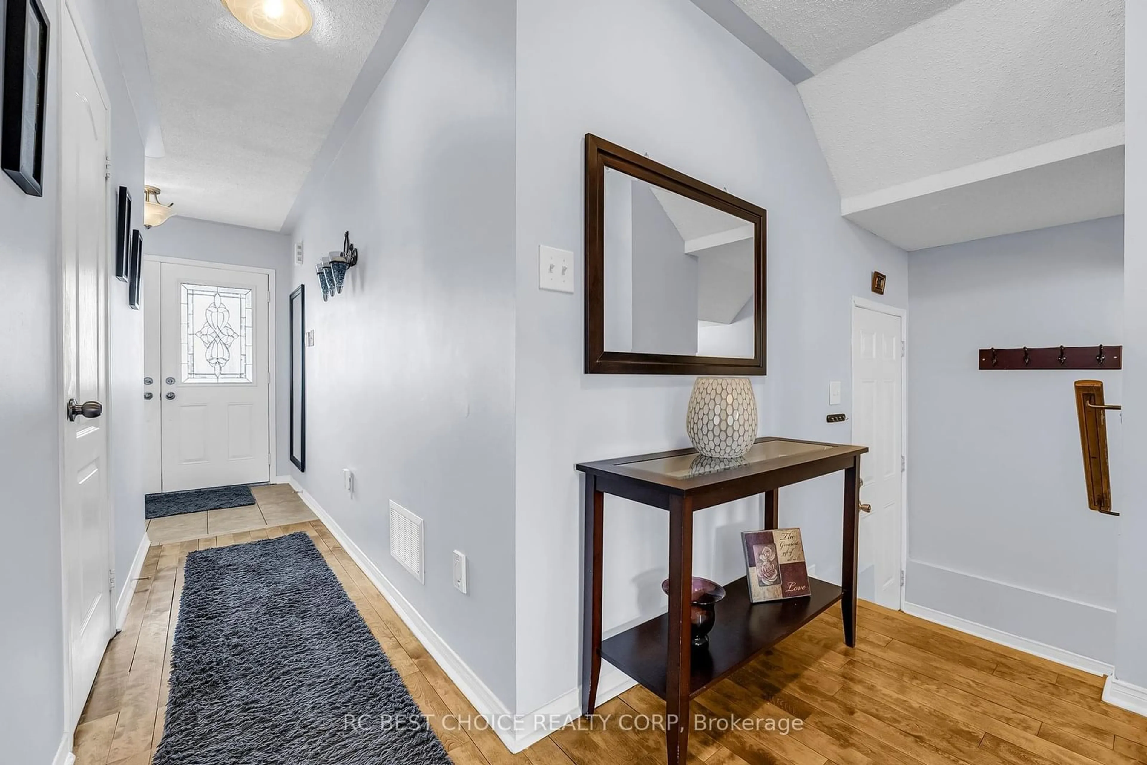 Indoor entryway, wood floors for 69 Roundstone Dr, Brampton Ontario L6X 0K4