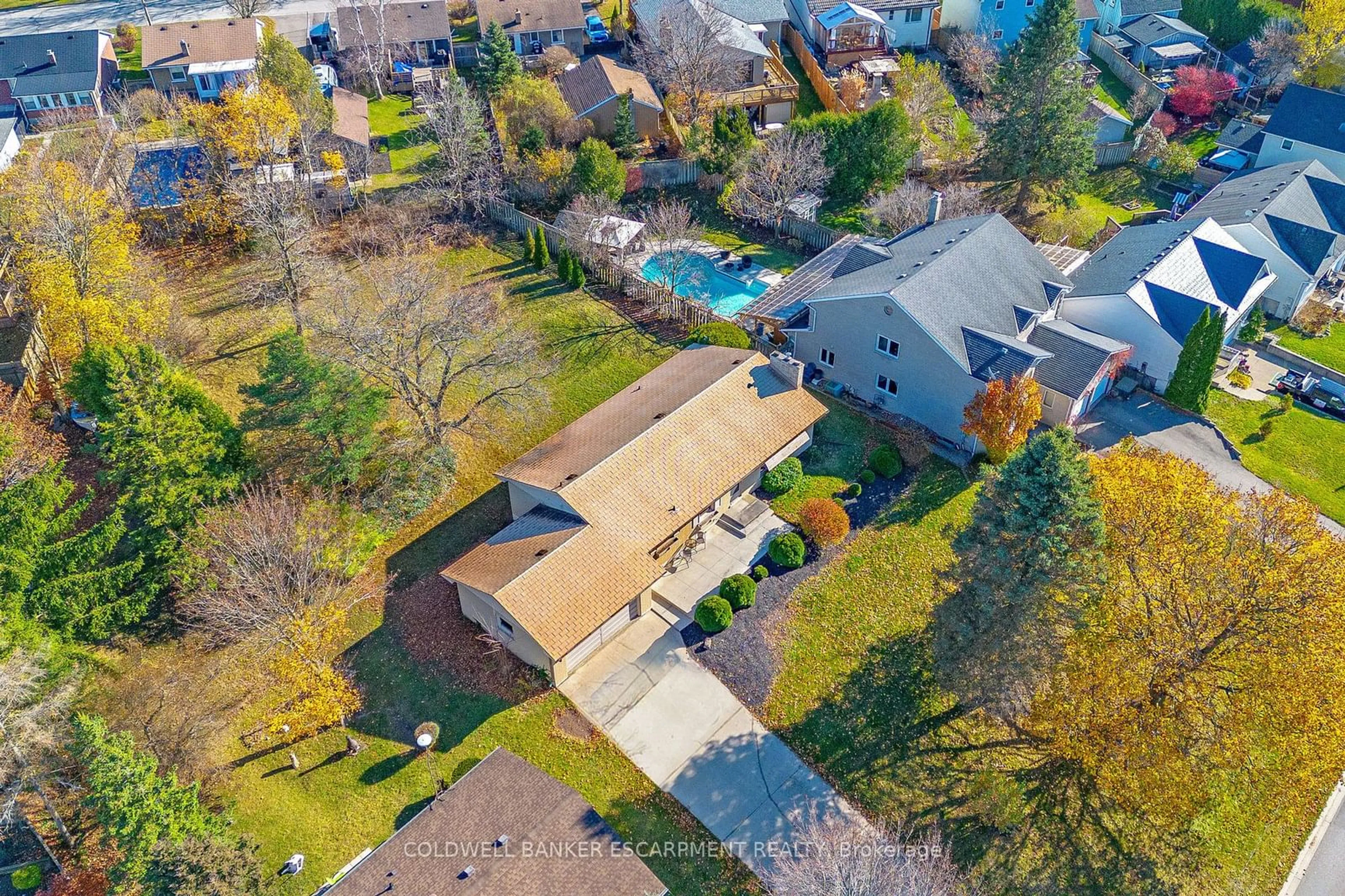 Frontside or backside of a home, the fenced backyard for 156 Mill St, Halton Hills Ontario L7J 1G5