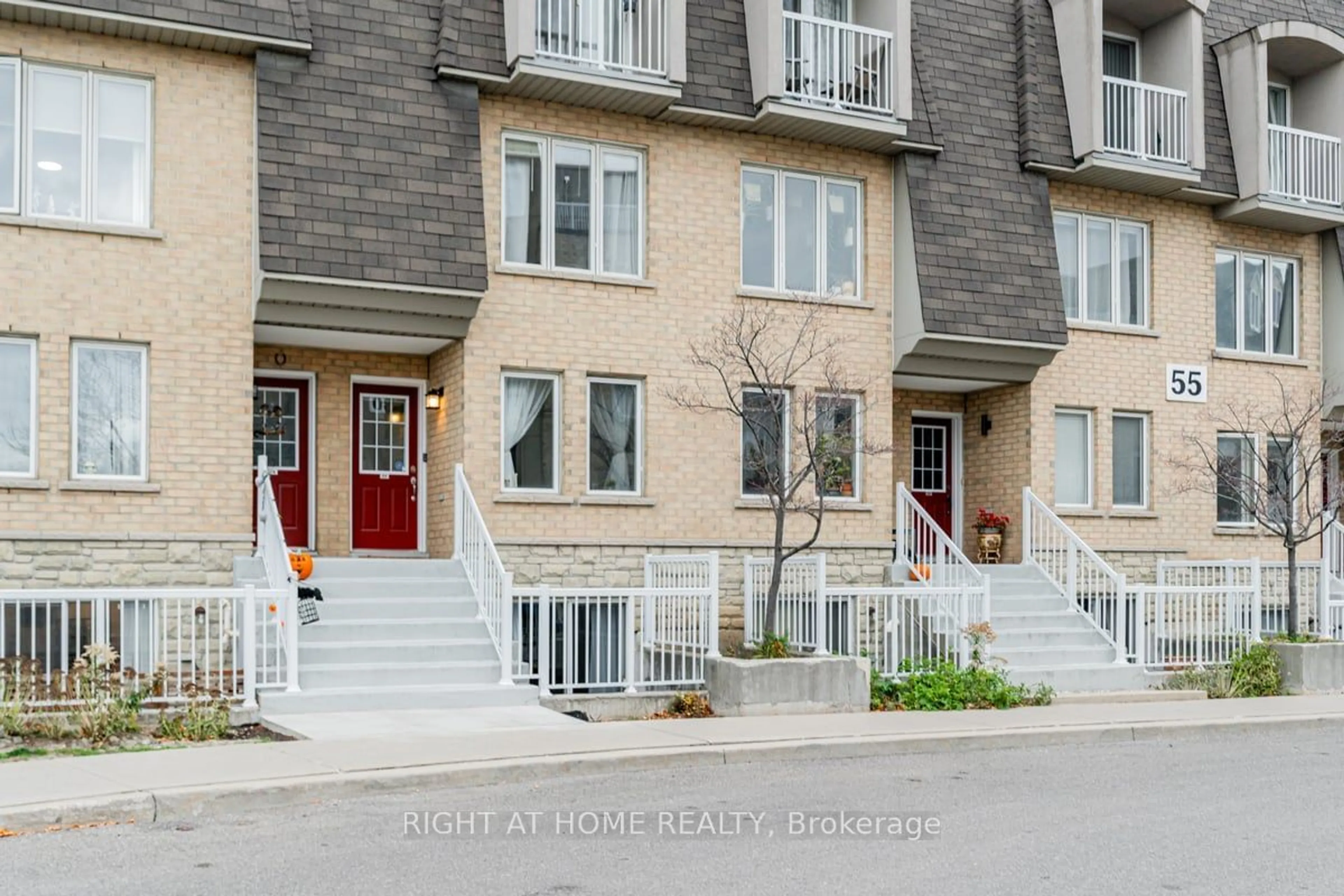 A pic from exterior of the house or condo, the street view for 55 Turntable Cres #77, Toronto Ontario M6H 4K8