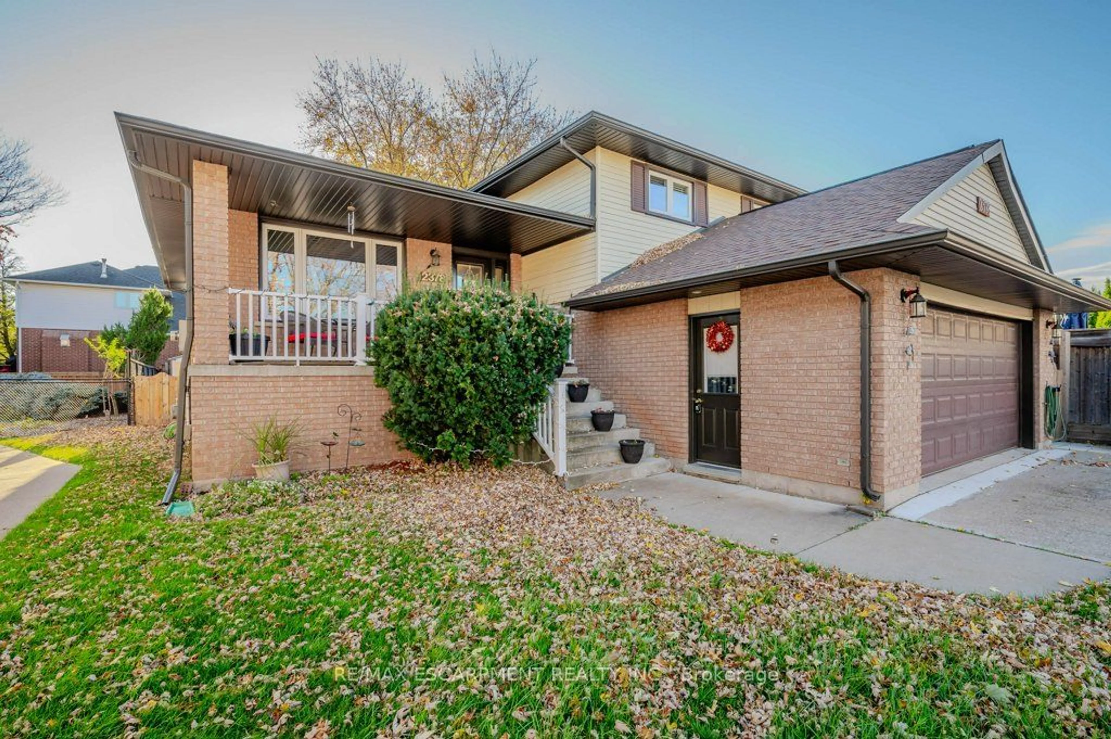 A pic from exterior of the house or condo, the fenced backyard for 2378 Headon Rd, Burlington Ontario L7M 4E2