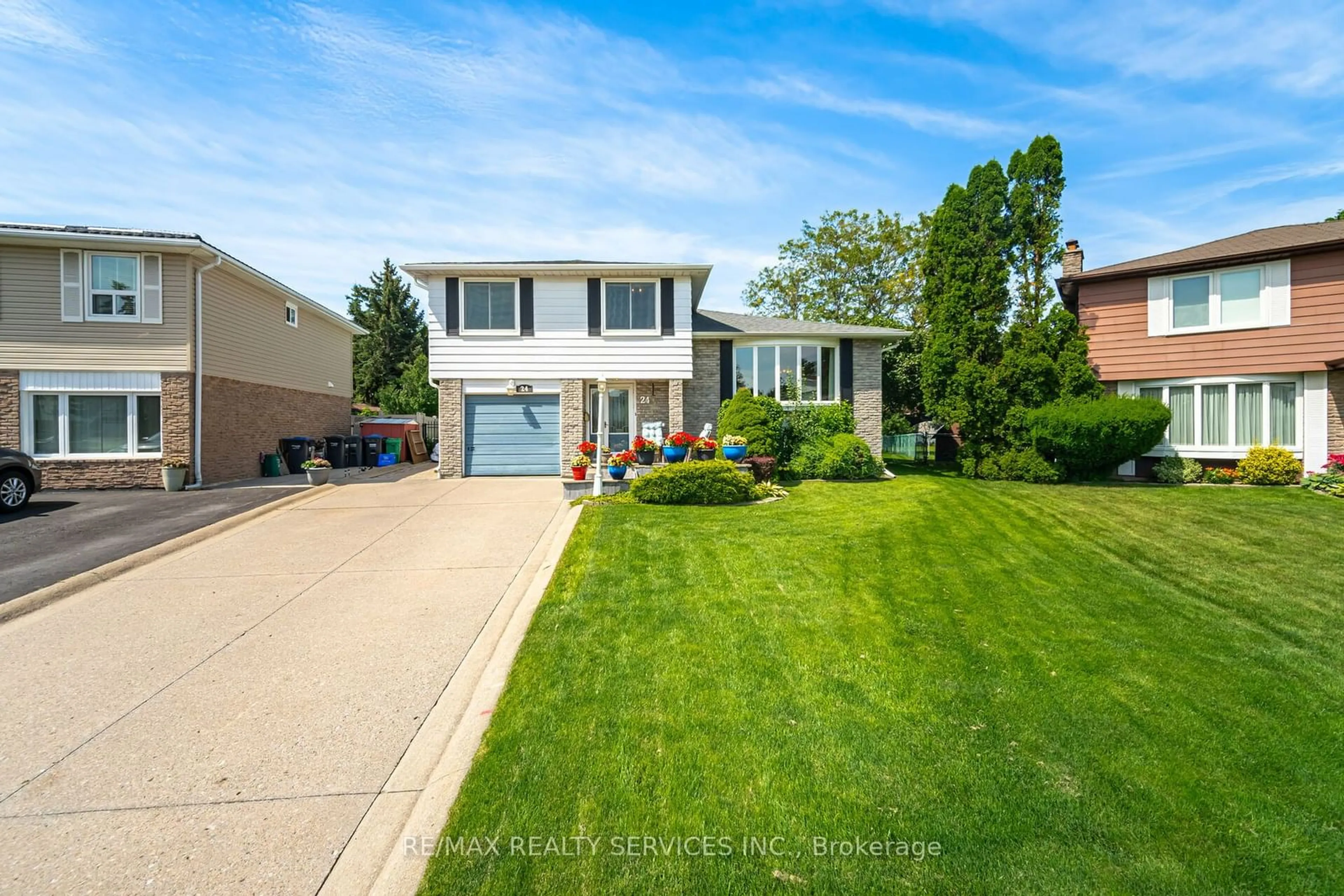 Frontside or backside of a home, the street view for 24 Grassington Crt, Brampton Ontario L6S 1Z4