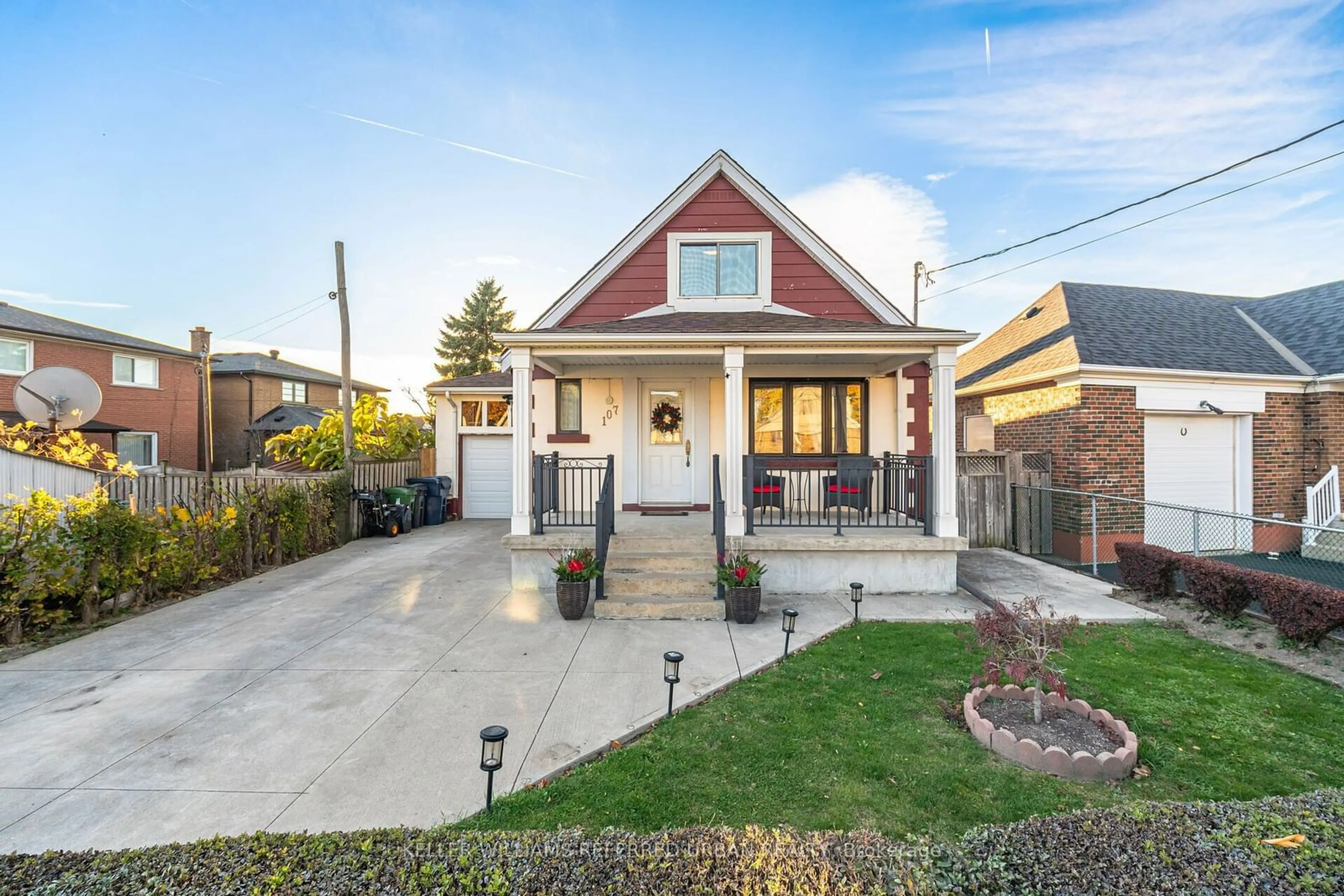 Frontside or backside of a home, the fenced backyard for 107 Strathnairn Ave, Toronto Ontario M6M 2G2