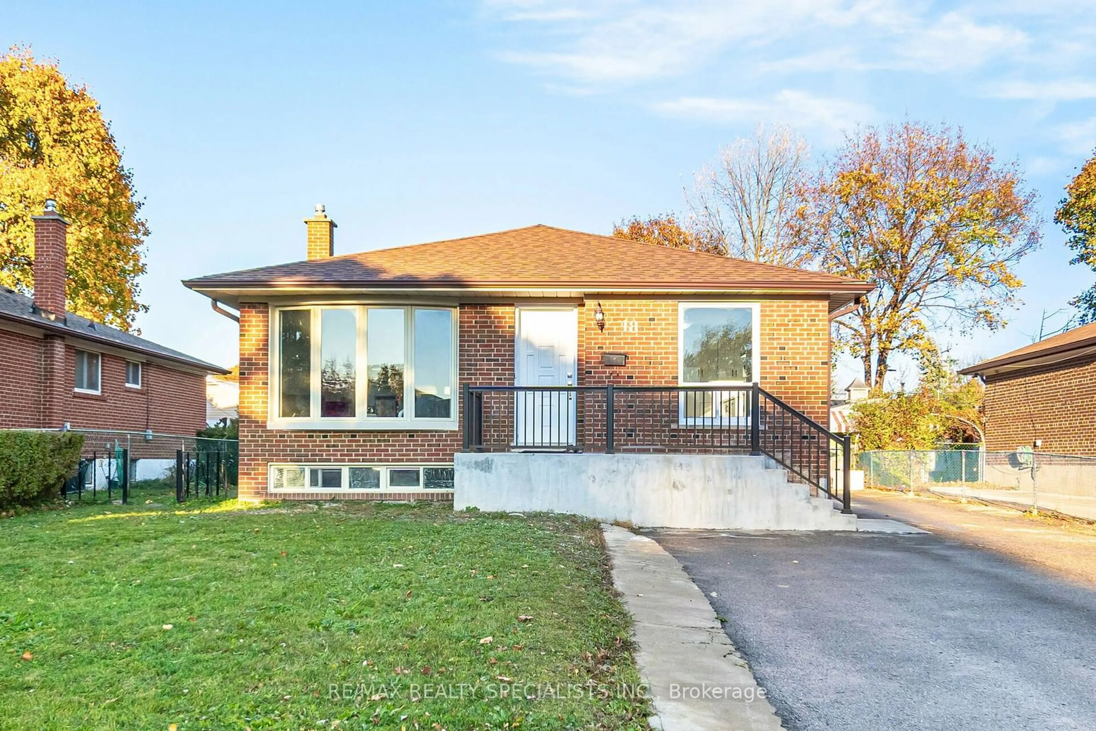 Frontside or backside of a home, the fenced backyard for 18 Sanford Cres, Brampton Ontario L6X 2C3