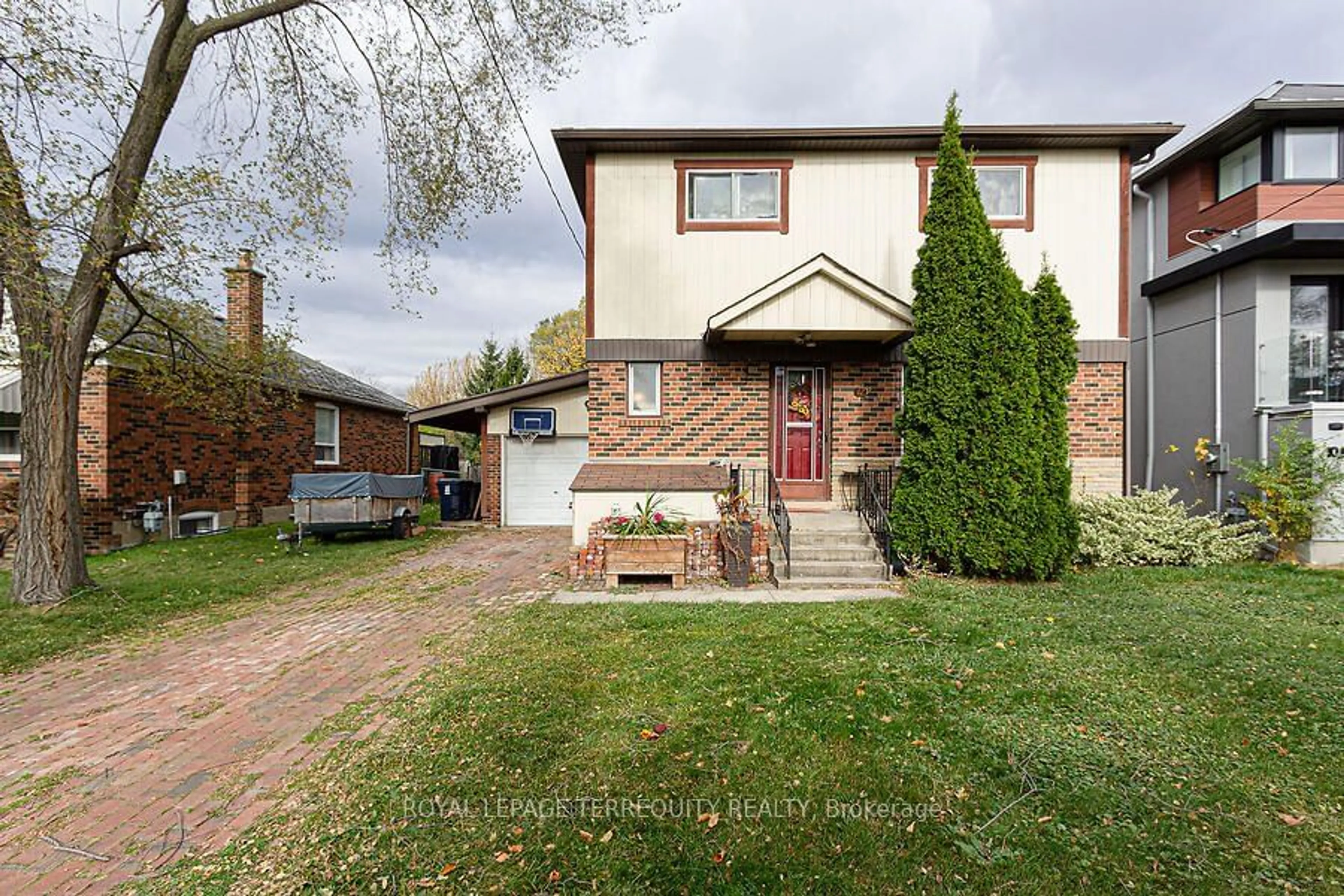 Frontside or backside of a home, the street view for 12 Chauncey Ave, Toronto Ontario M8Z 2Z3