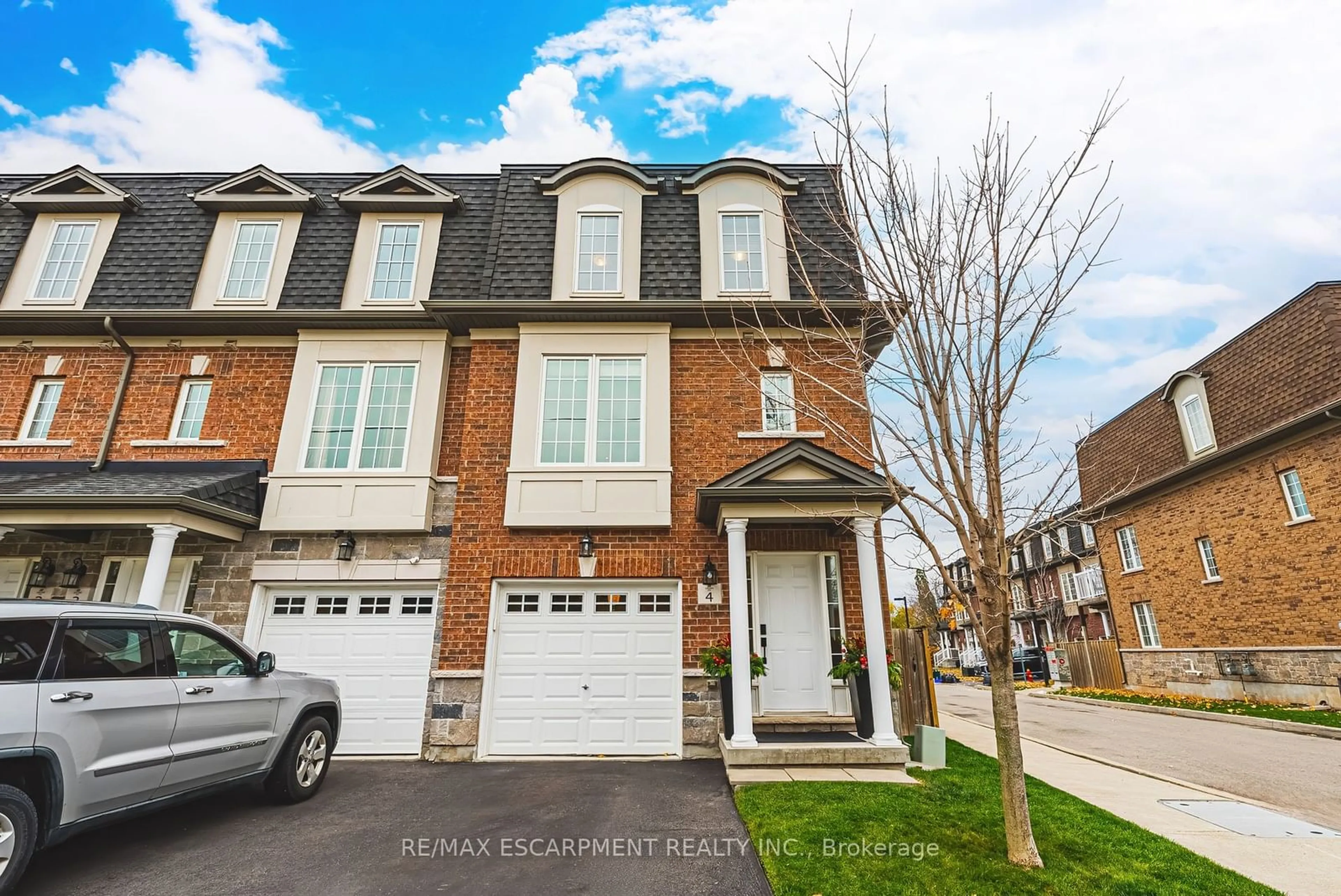 A pic from exterior of the house or condo, the street view for 2220 Queensway Dr #4, Burlington Ontario L7R 0E7