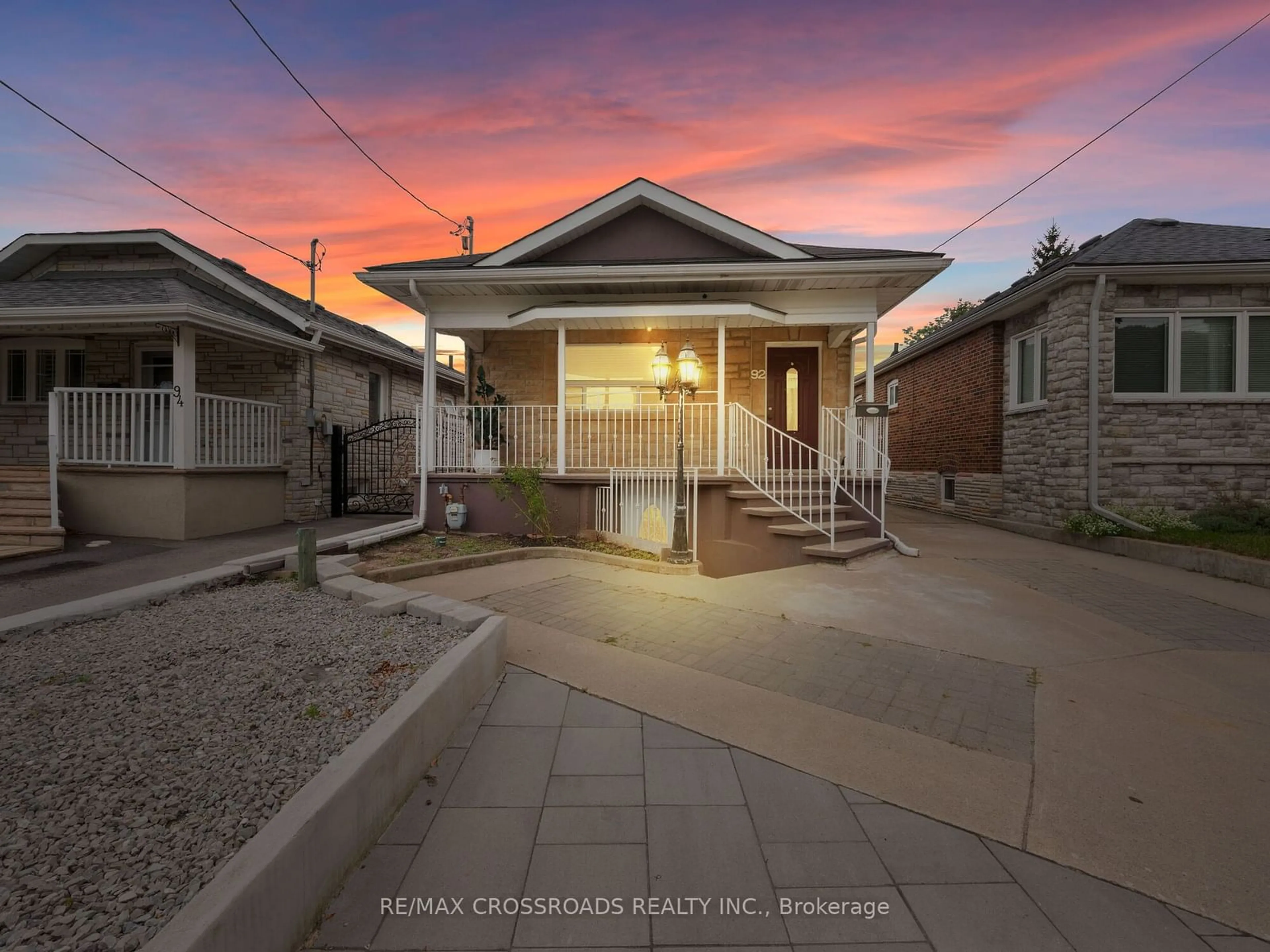 Frontside or backside of a home, the fenced backyard for 92 Foxwell St, Toronto Ontario M6N 1Z5