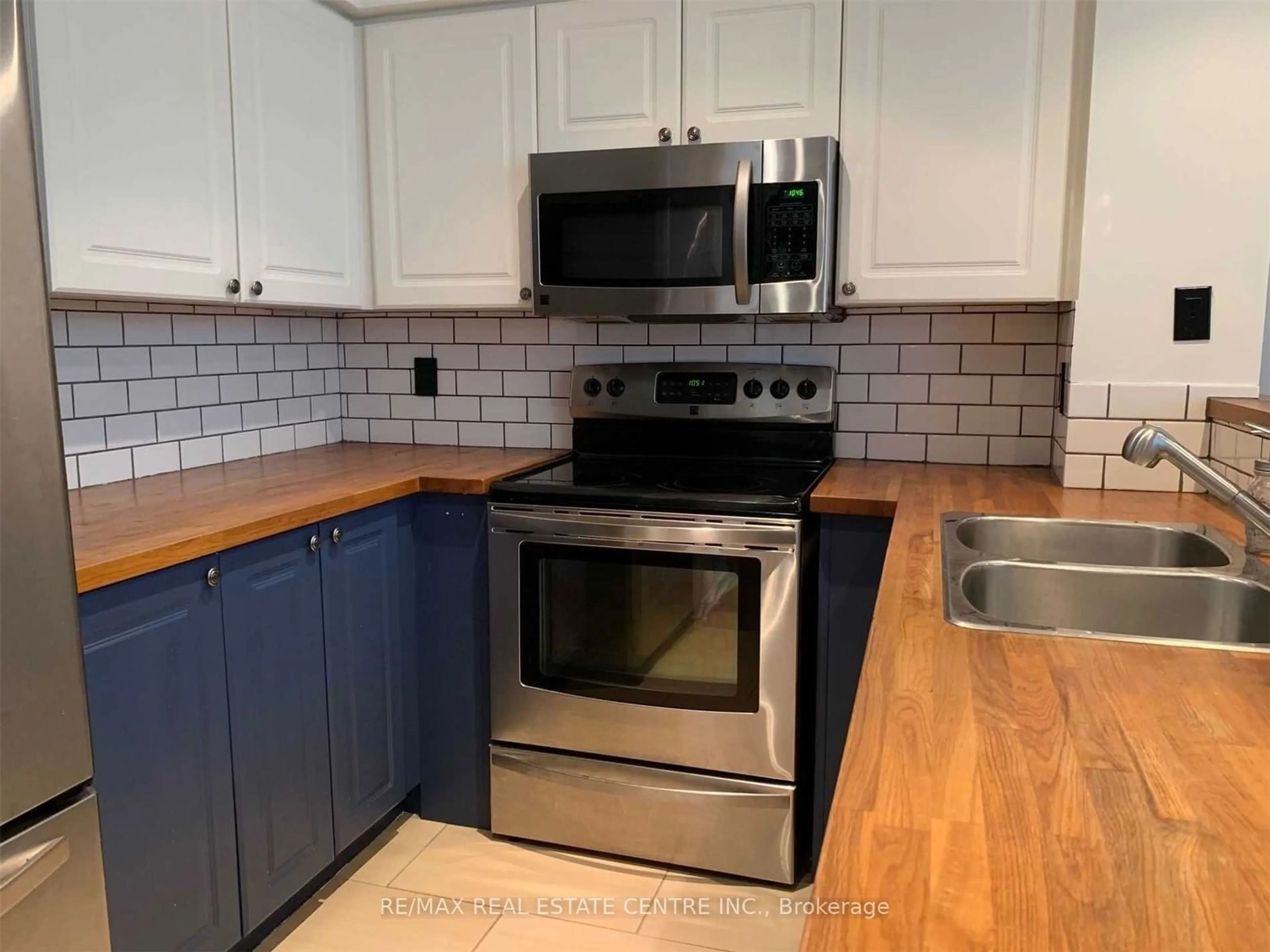 Standard kitchen, wood floors for 300 Manitoba St #102, Toronto Ontario M8Y 4G6