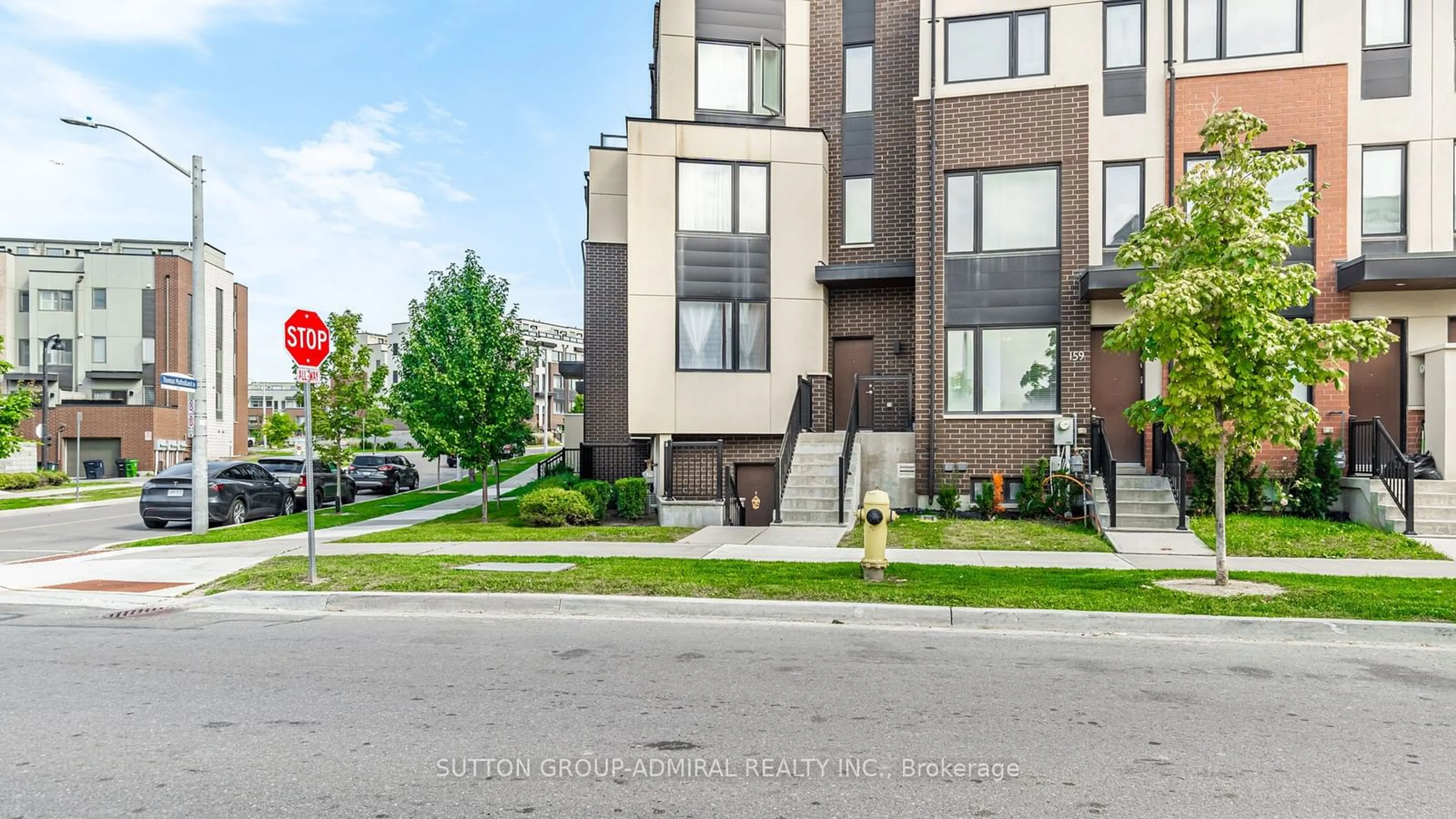 A pic from exterior of the house or condo, the street view for 161 Frederick Tisdale Dr #1, Toronto Ontario M3K 0B5